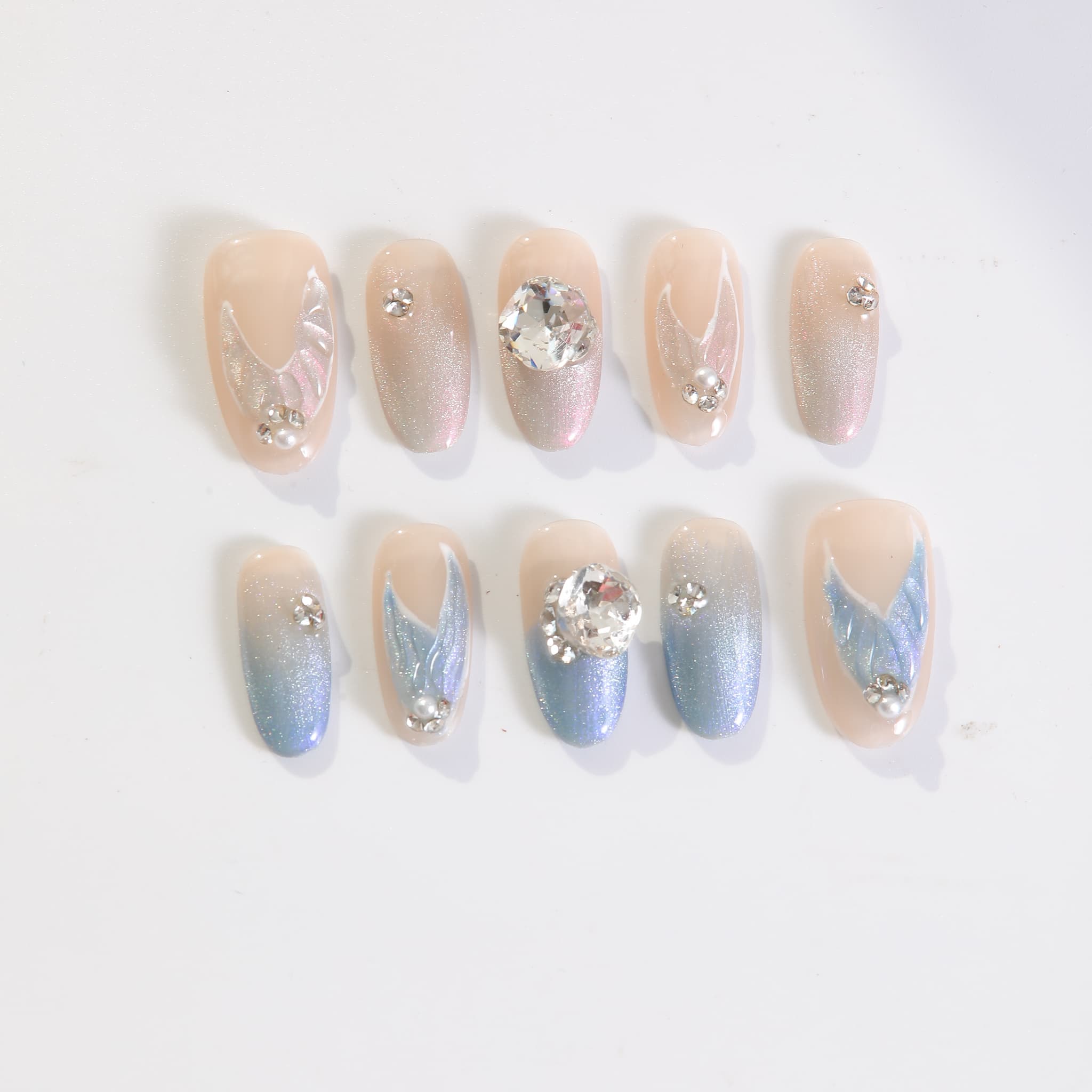 medium length light blue oval press on nails with mermaid tails design and gemstones