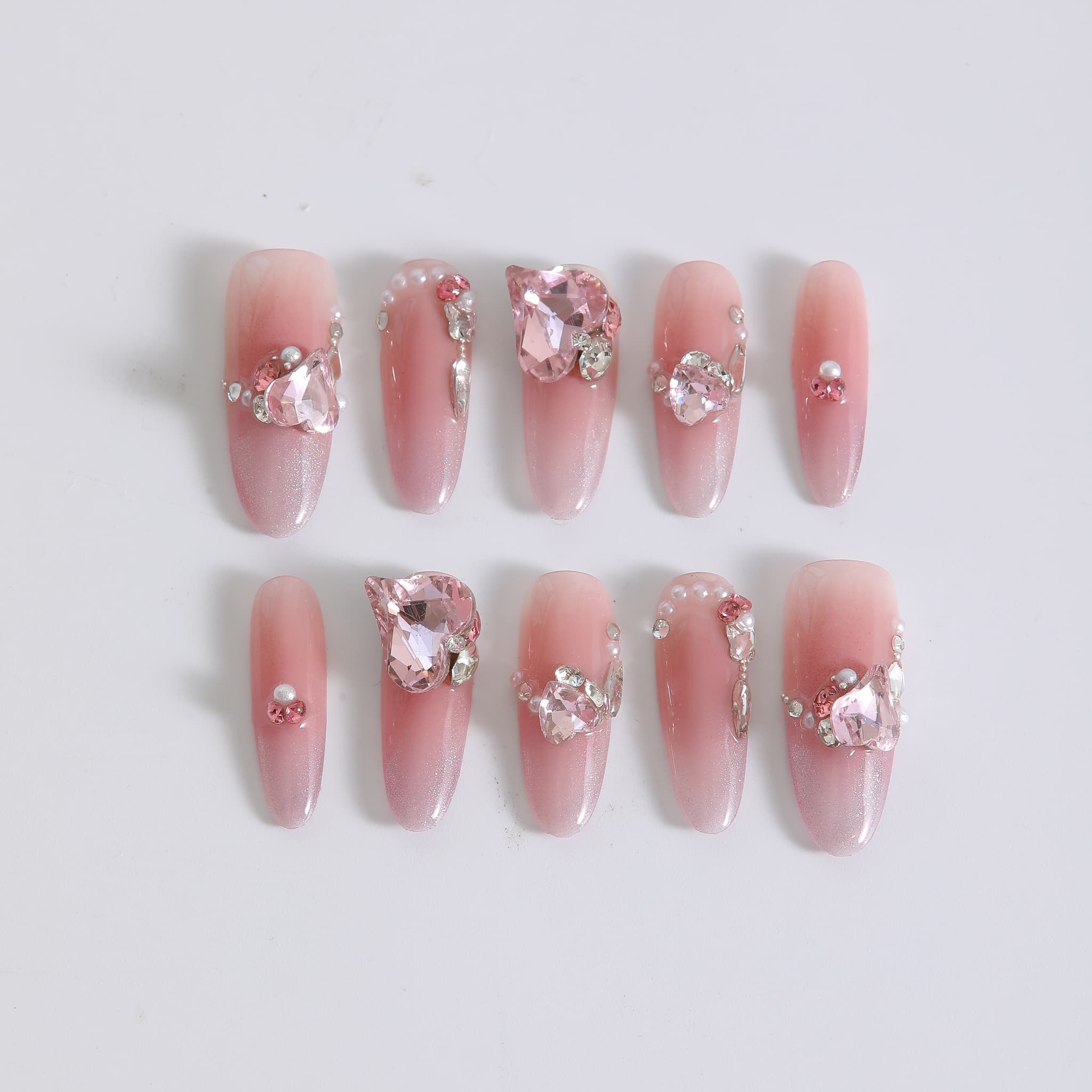 long length light pink oval press on nails with gemstones