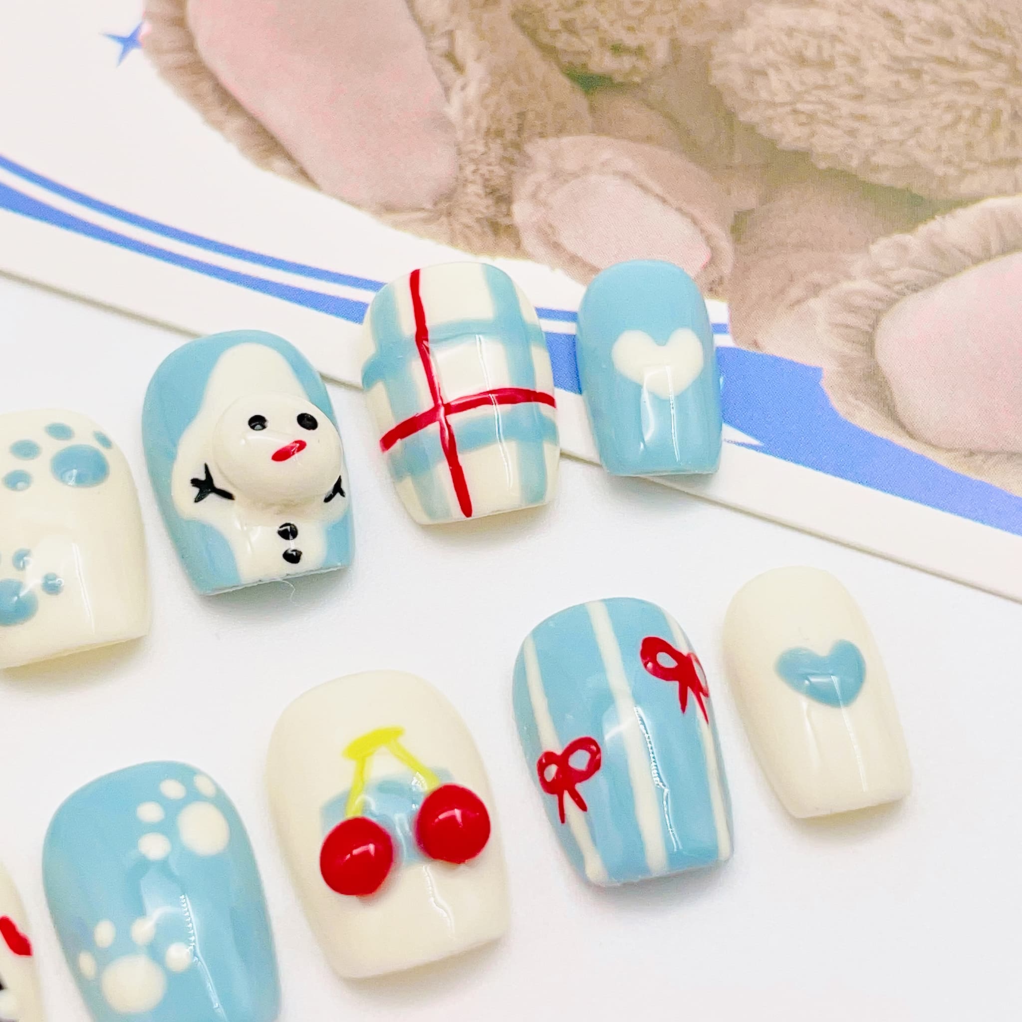 short length light blue squoval press on nails with cat design, winter season design