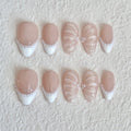 Set of decorative nails with white accents and pearl embellishments 