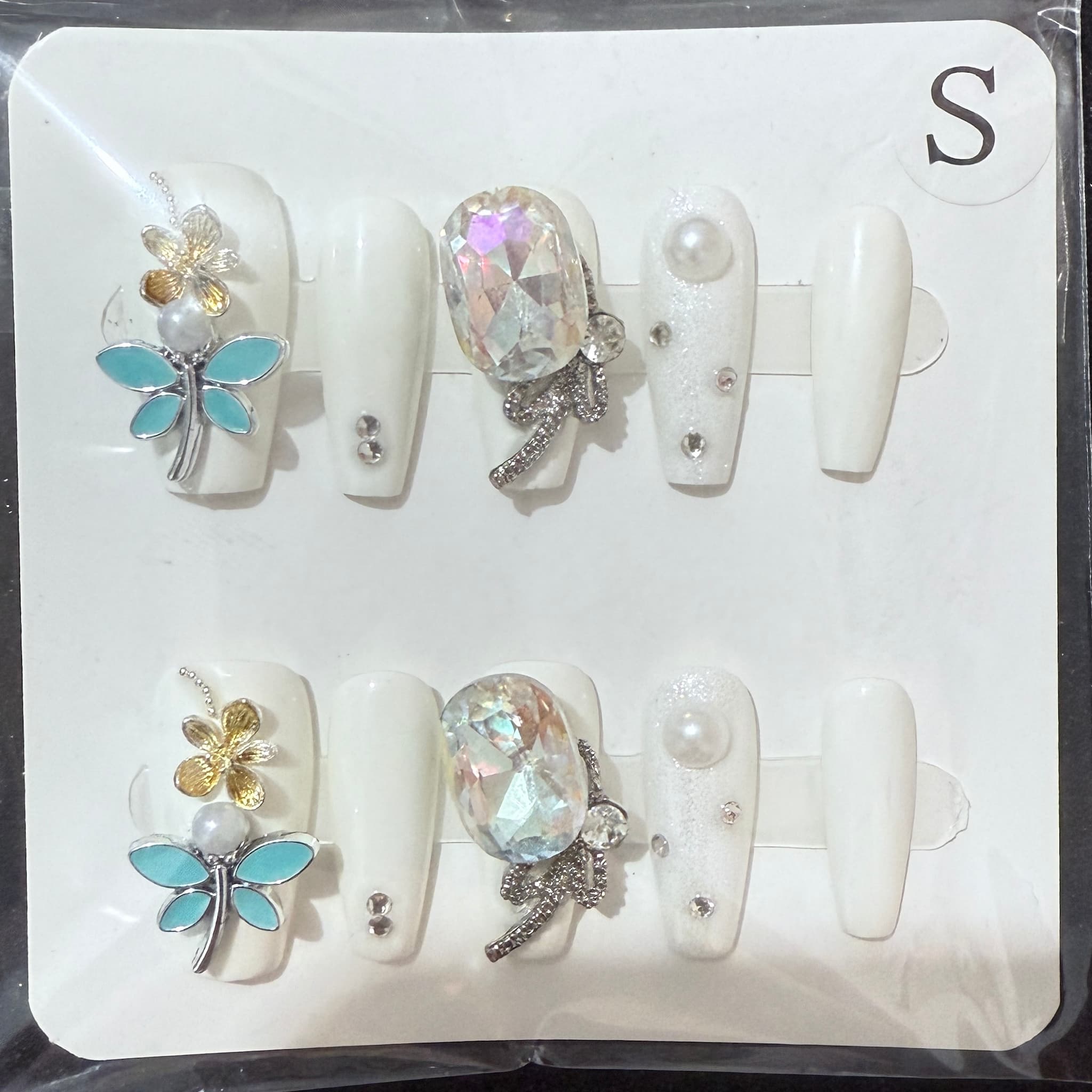 medium length white coffin press on nails with butterfly charms