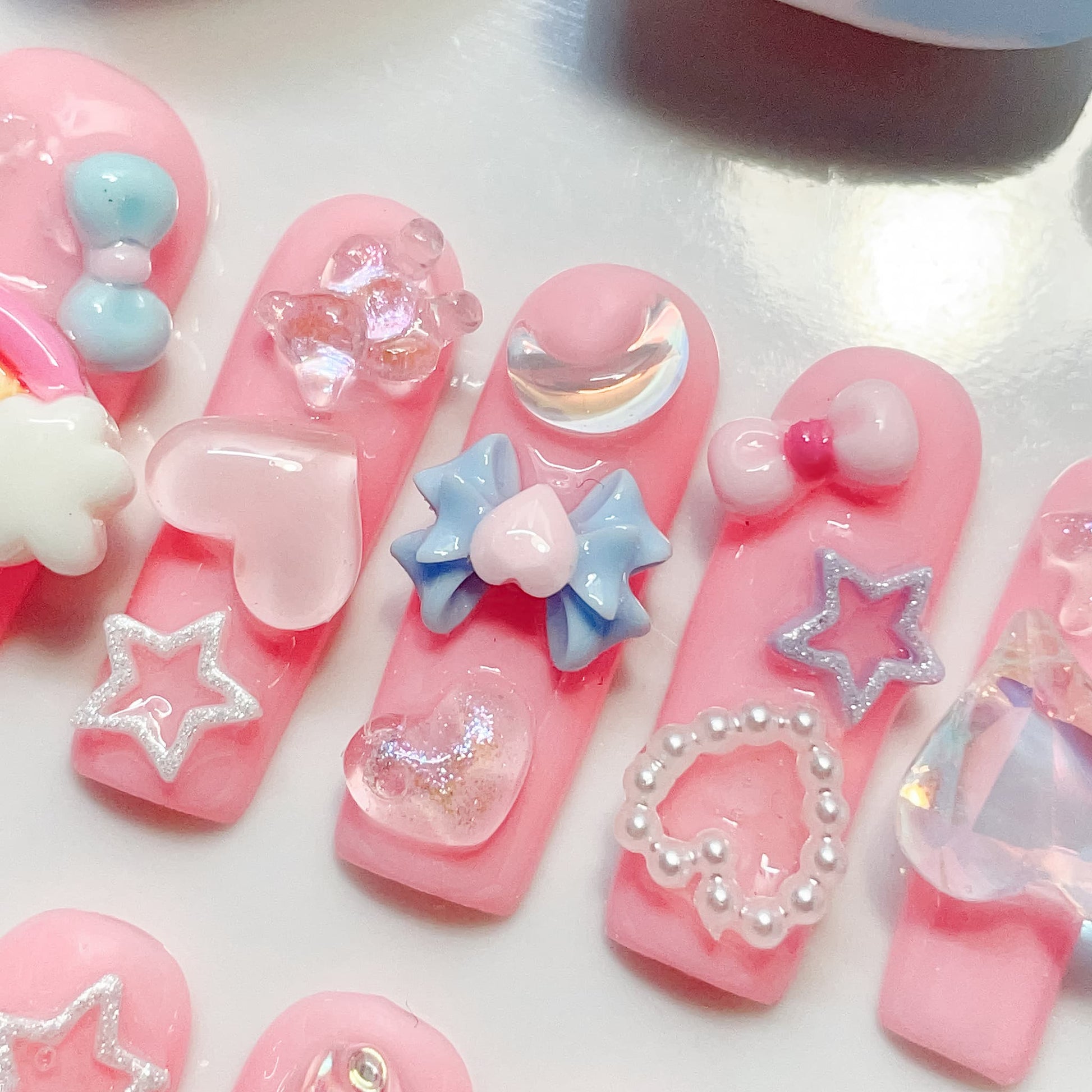 long length light pink square press on nails with star , bows , bear, heart shape and butterfly charm