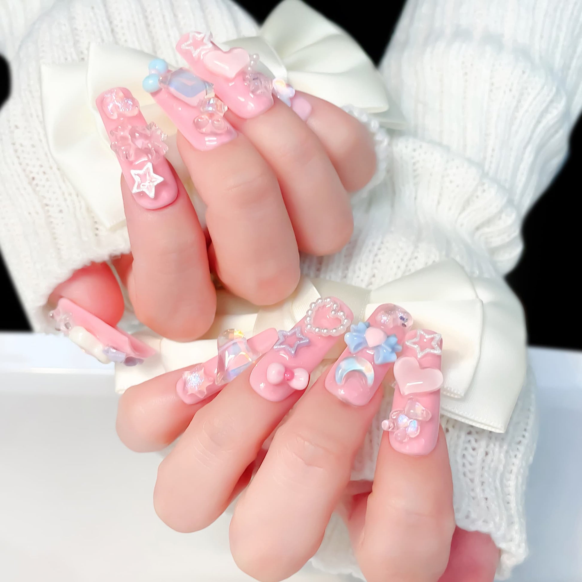 long length light pink square press on nails with star , bows , bear, heart shape and butterfly charm