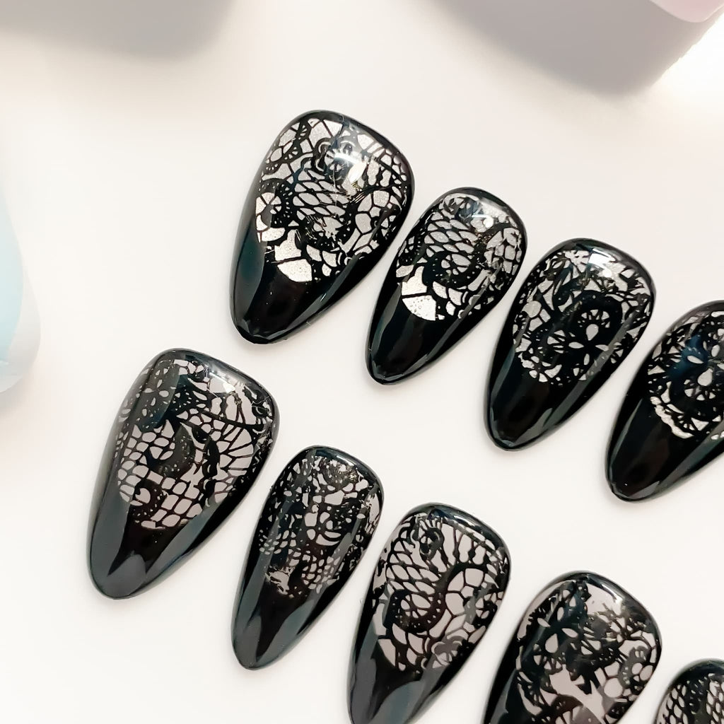 short length black almond press on nails with lace design