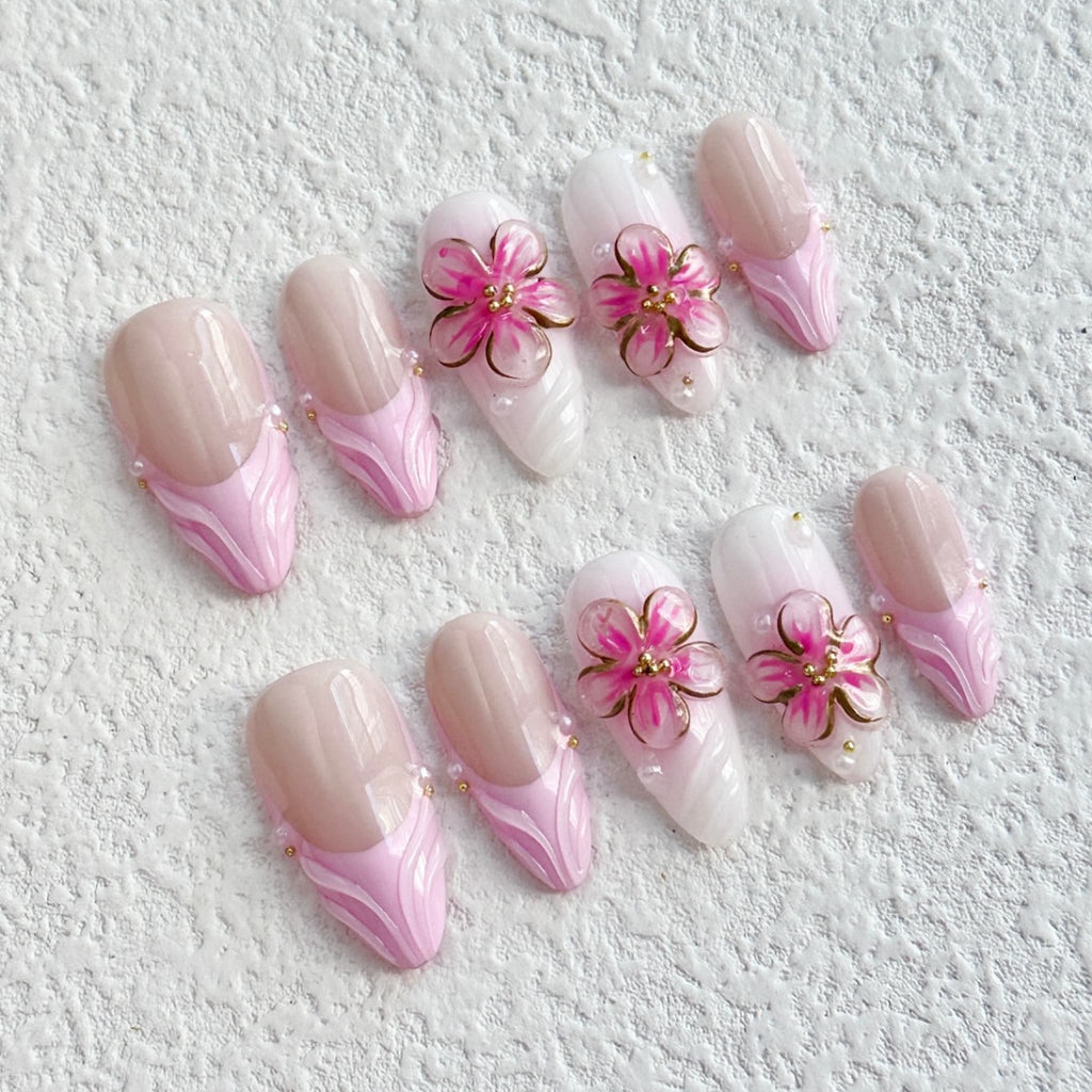 medium length pink almond press on nails with 3d petal flower design, french tips press on nails