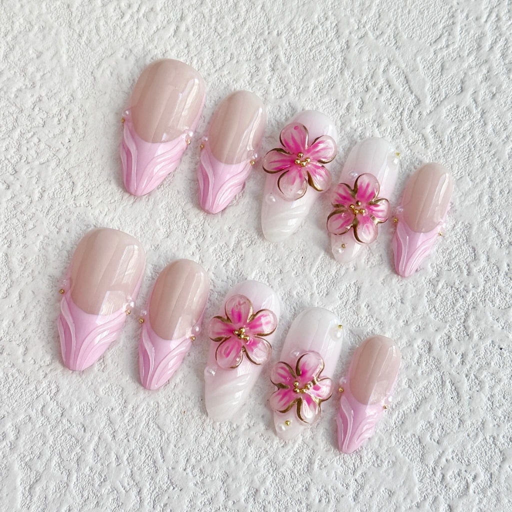 medium length pink almond press on nails with 3d petal flower design, french tips press on nails