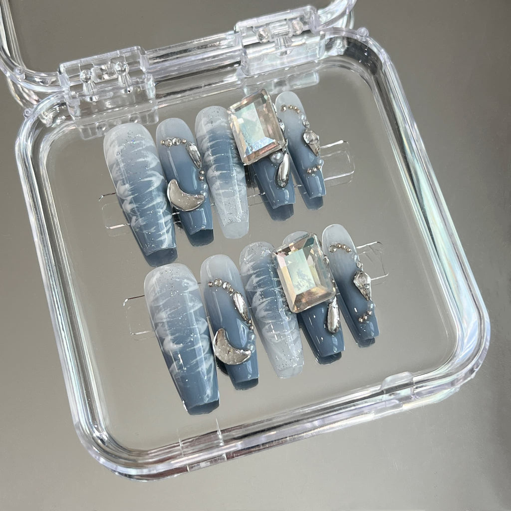 long length dodger blue coffin press on nails with metallic decorations, crescent moon shape and large rectangle gems
