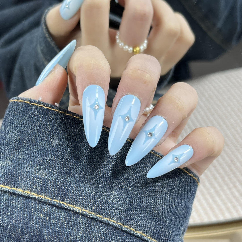 long length powder blue stiletto press on-nails with star symbol