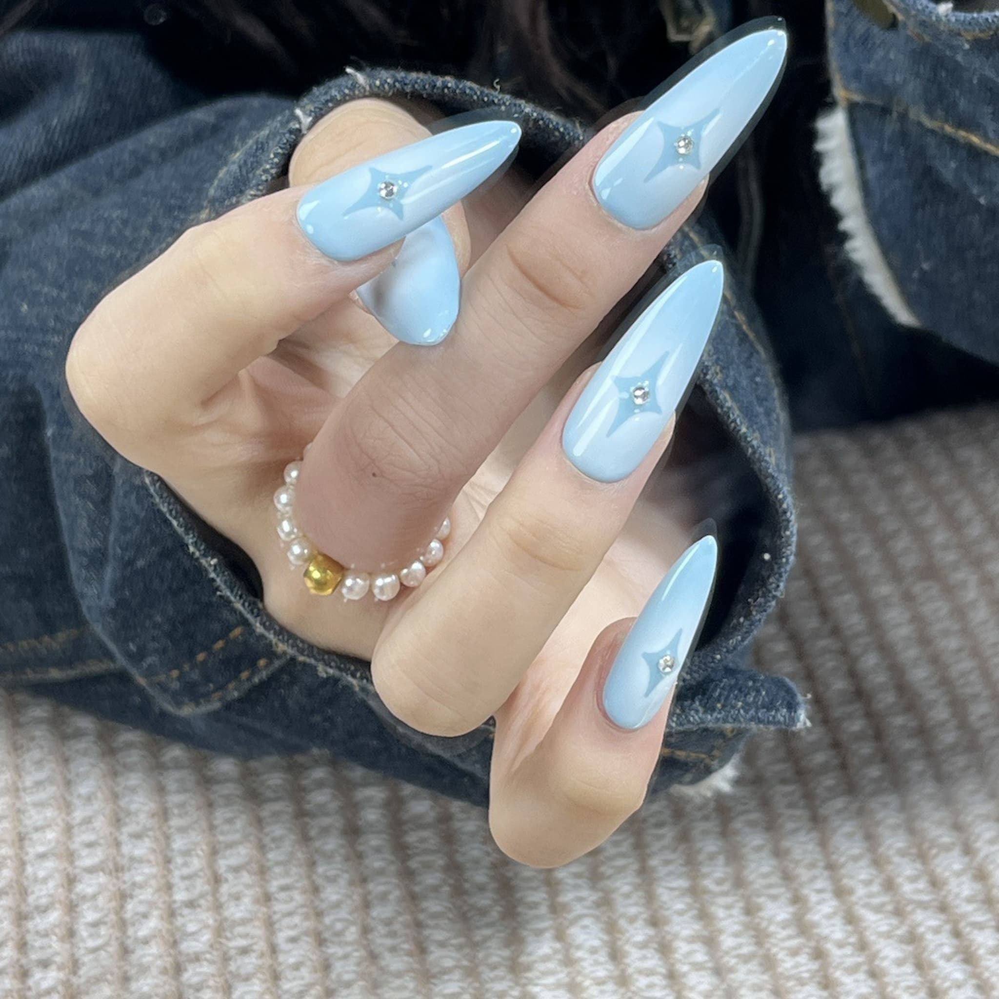 long length powder blue stiletto press on-nails with star symbol
