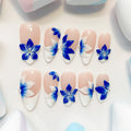 medium length blue almond press on nails with 3d flowers design