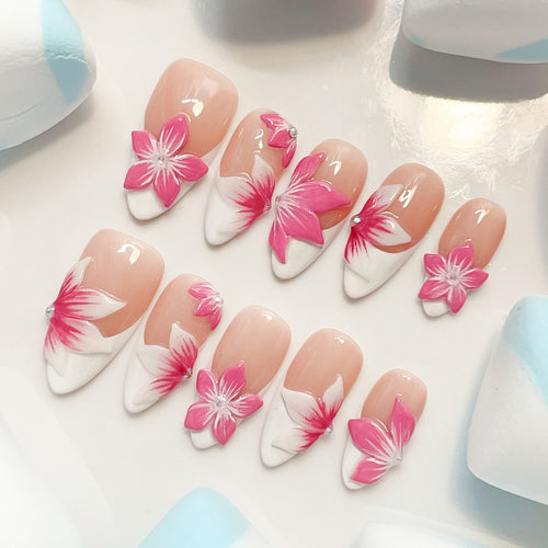 medium length pink almond press on nails with craved flowers design