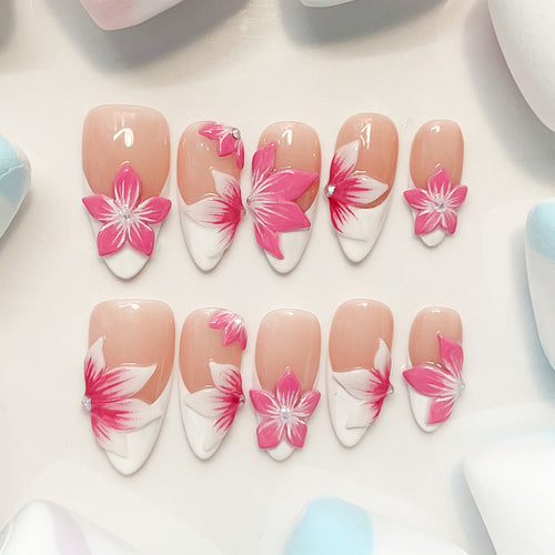 medium length pink almond press on nails with craved flowers design