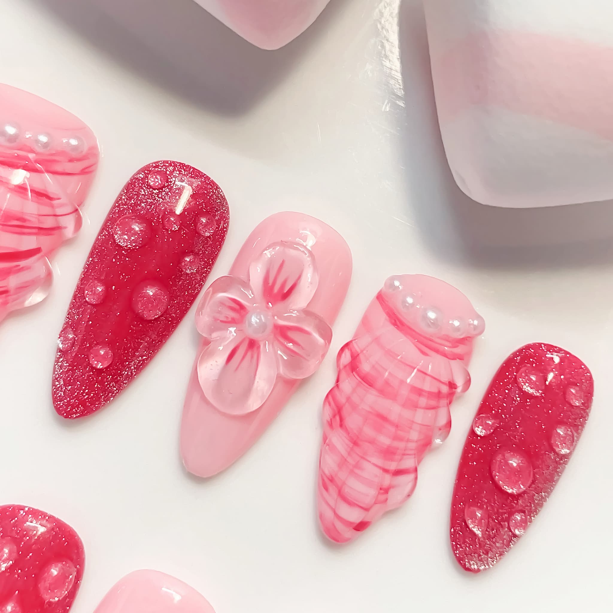 medium length hot pink almond press on nails with seashell designs