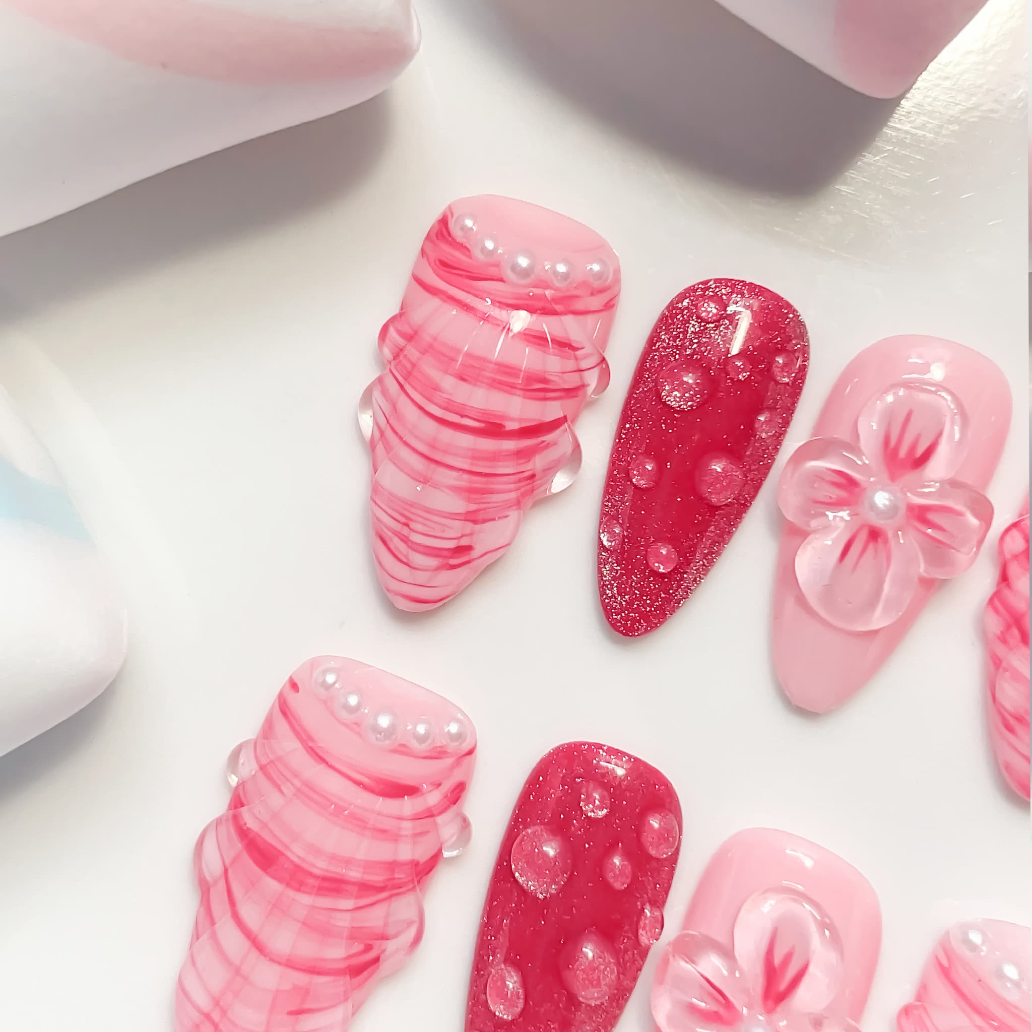 medium length hot pink almond press on nails with seashell designs
