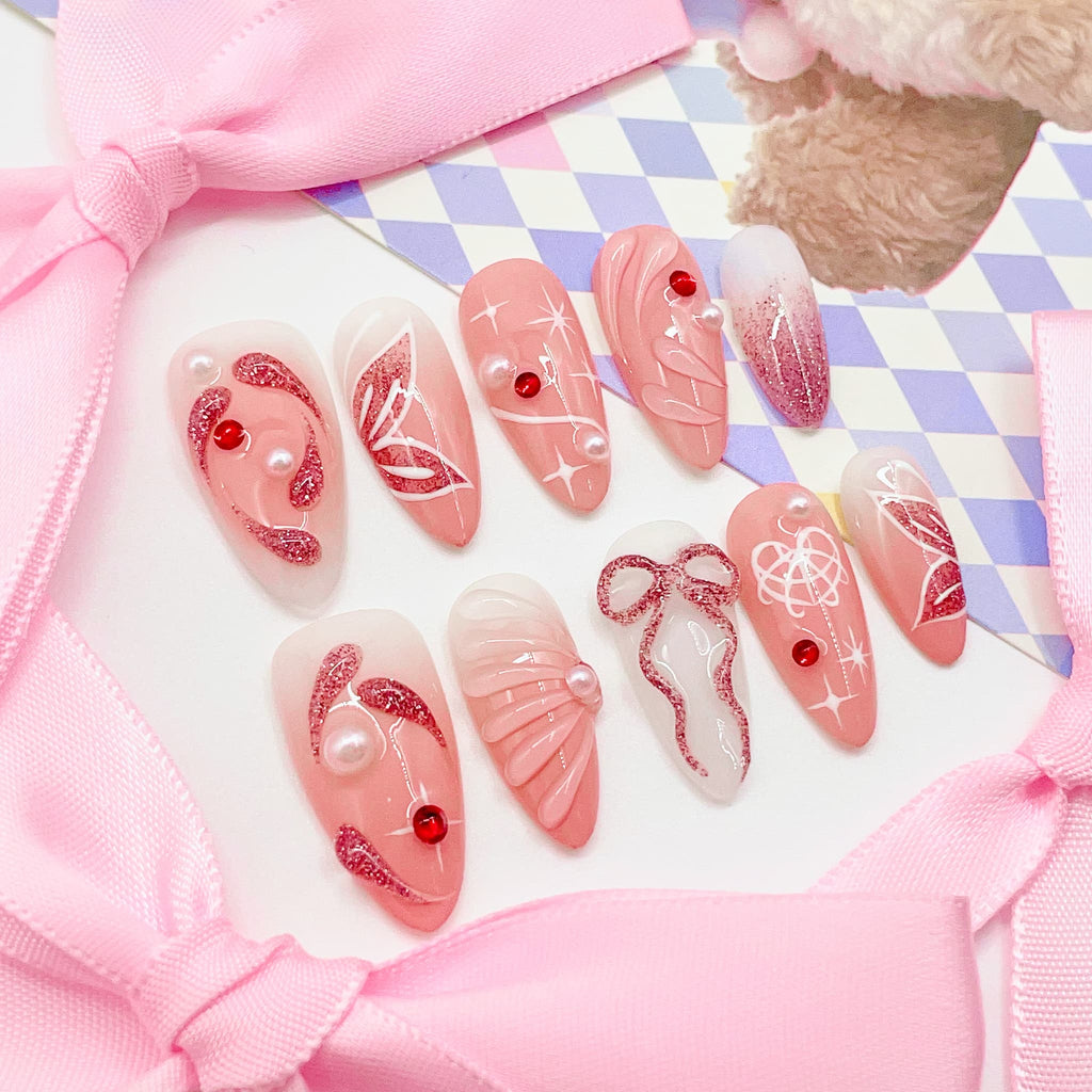 medium length light pink press on nails with butterfly design