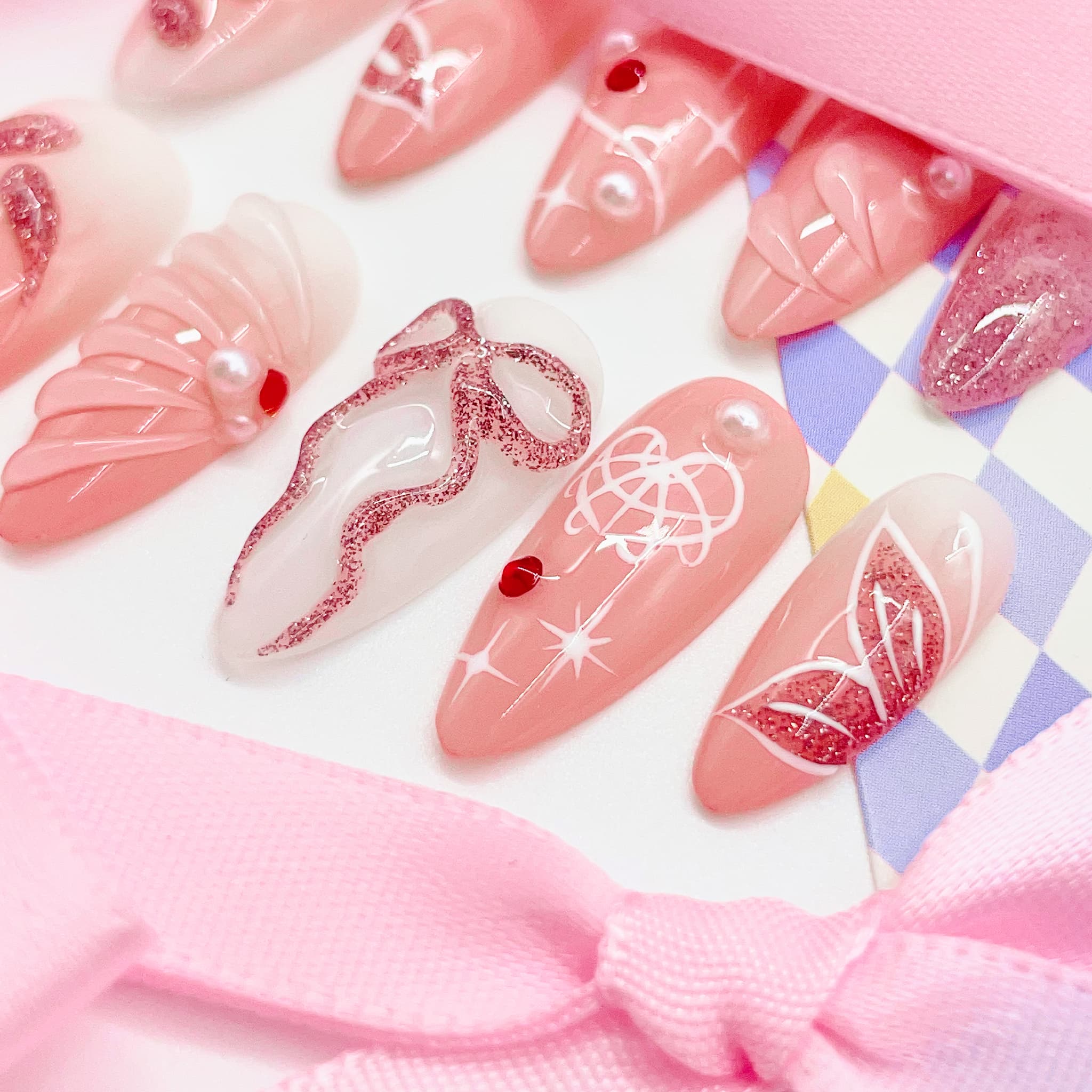 medium length light pink press on nails with butterfly design