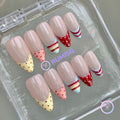 pastelcore nude glossy medium almond press on nails with polka dot and candy stripe french tip