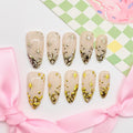 Set of beige nail art designs with gold  decorations