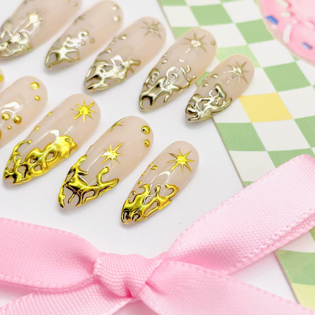 Set of beige nail art designs with gold  decorations