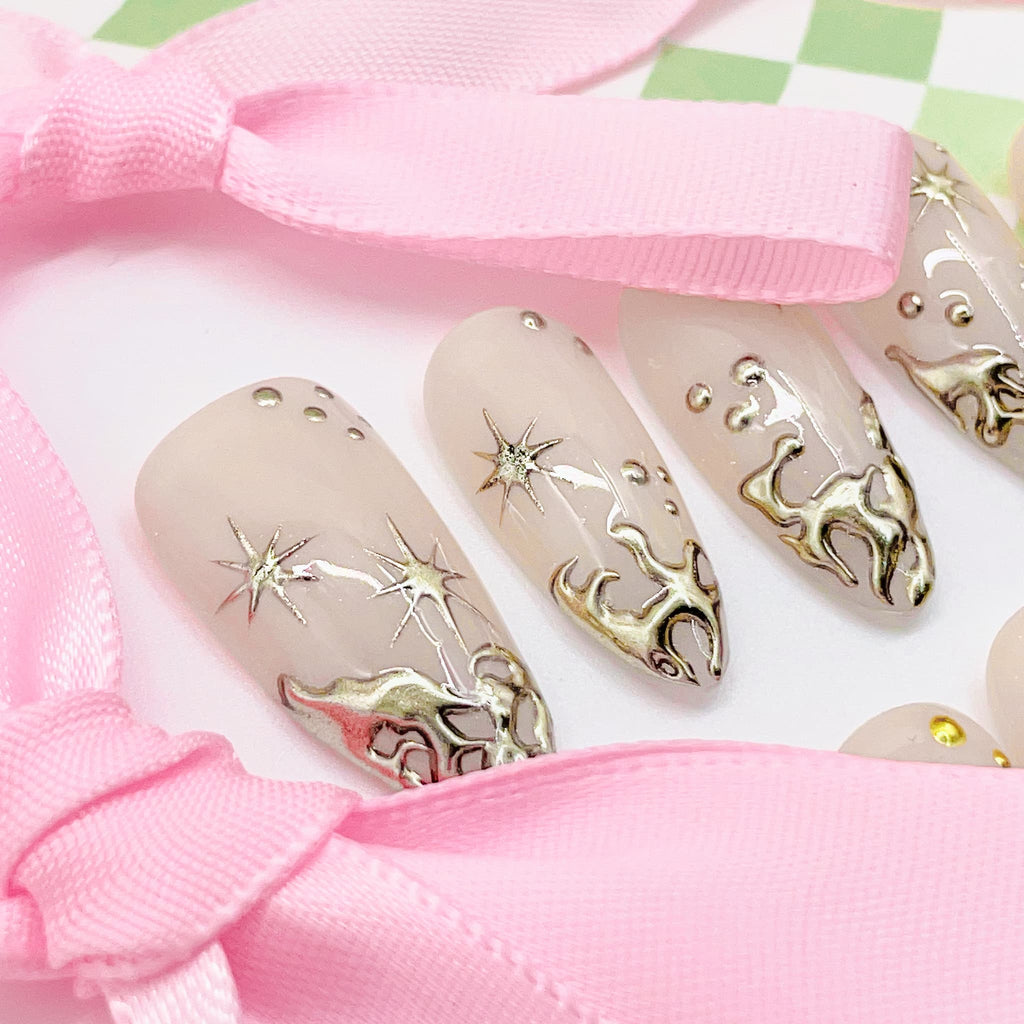 Set of beige nail art designs with gold  decorations