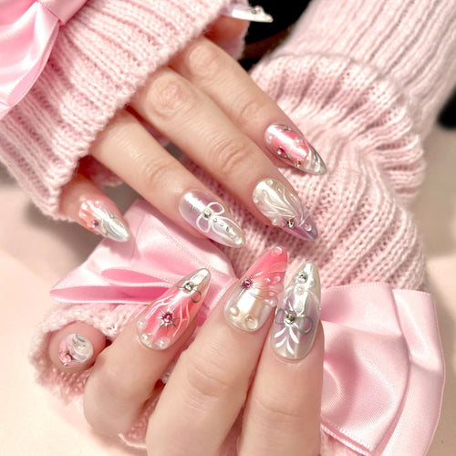 medium length thistle almond press on nails with elegant design and wings