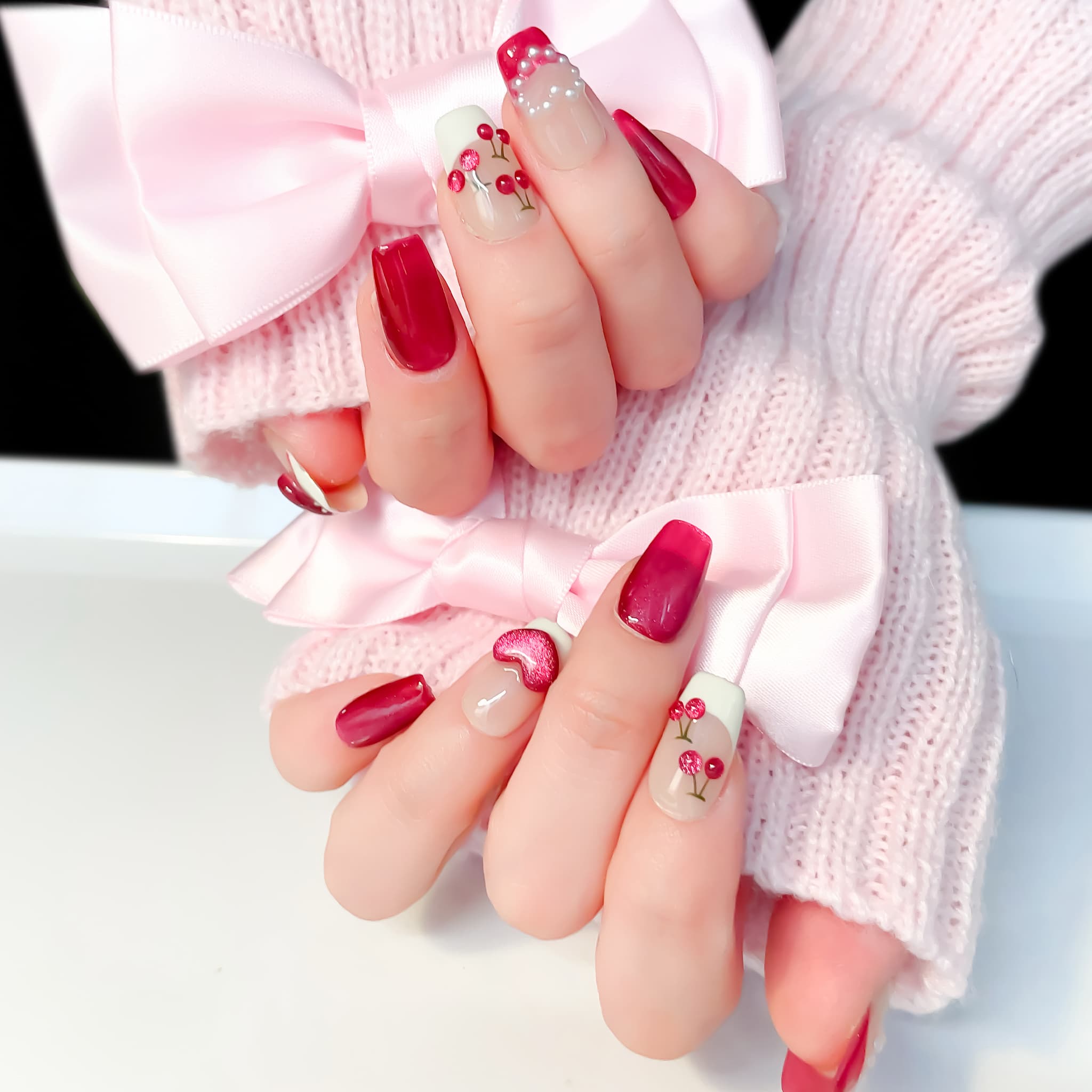 short length deep pink coffin press on nails with cherry and pearls design