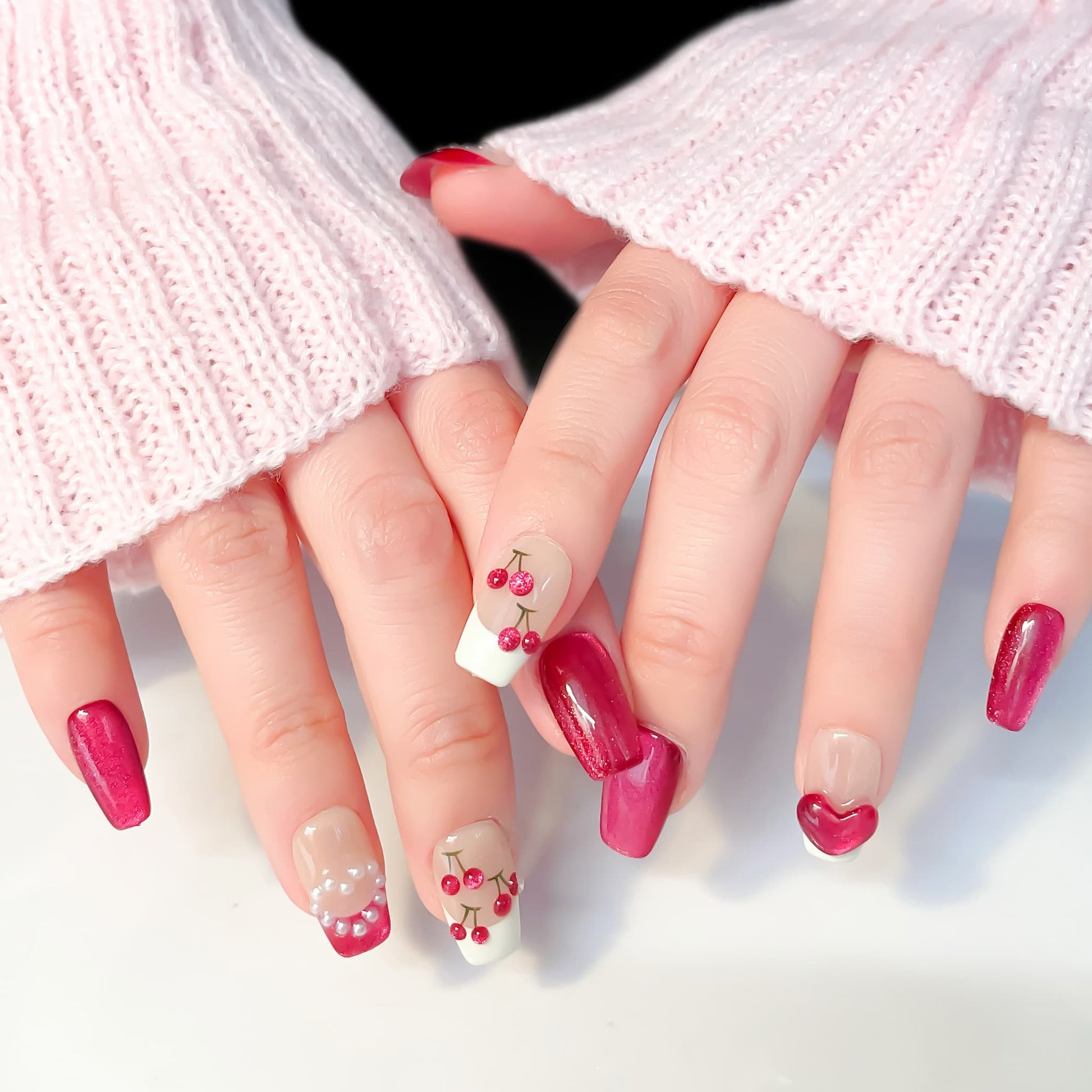 short length deep pink coffin press on nails with cherry and pearls design