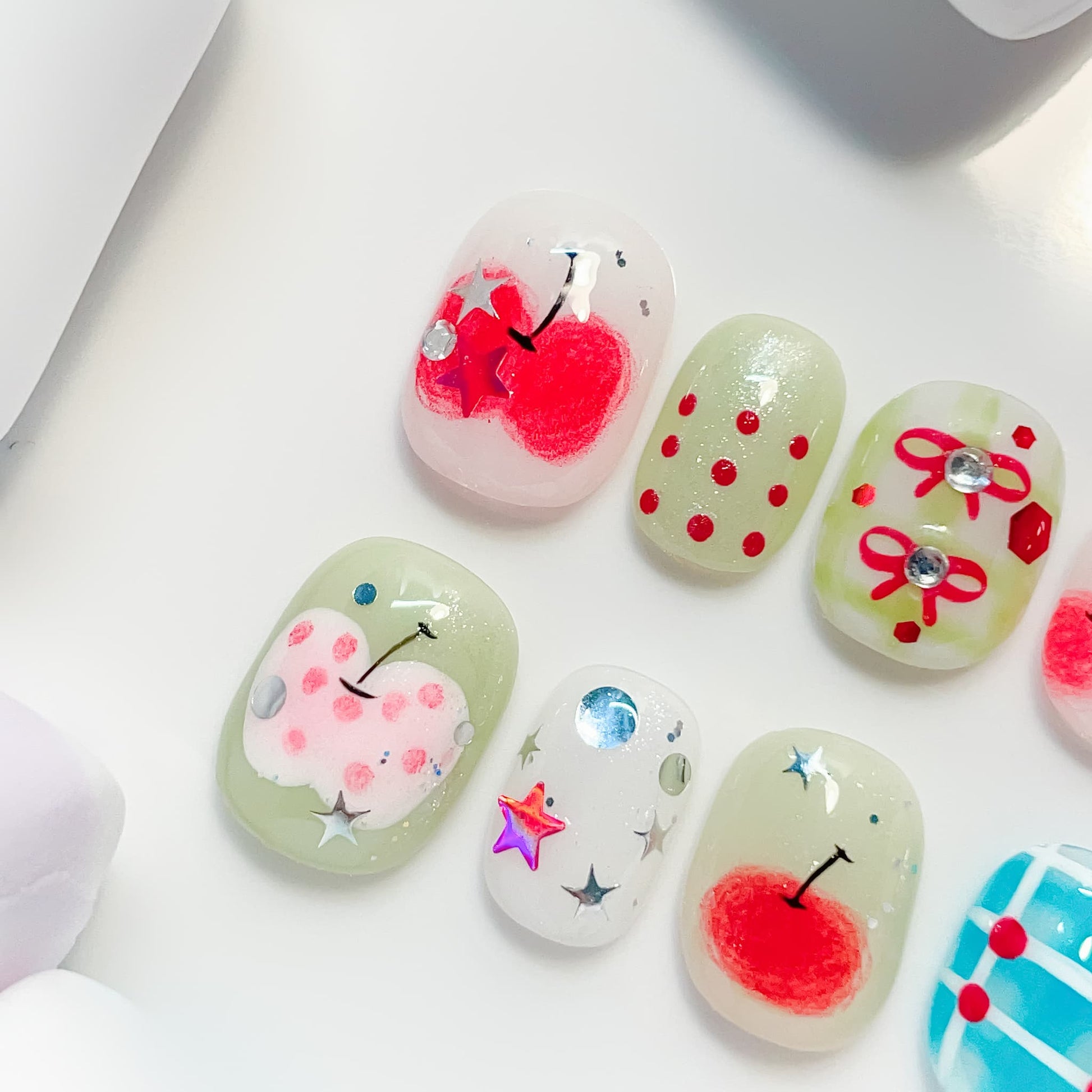 short length red oval press on nails with cherry design