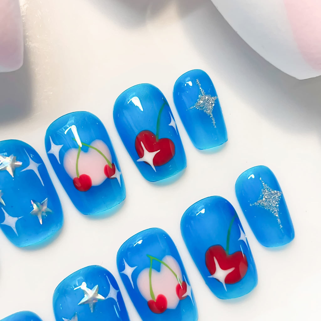 short length deep sky blue coffin press on nails with cherry and star designs
