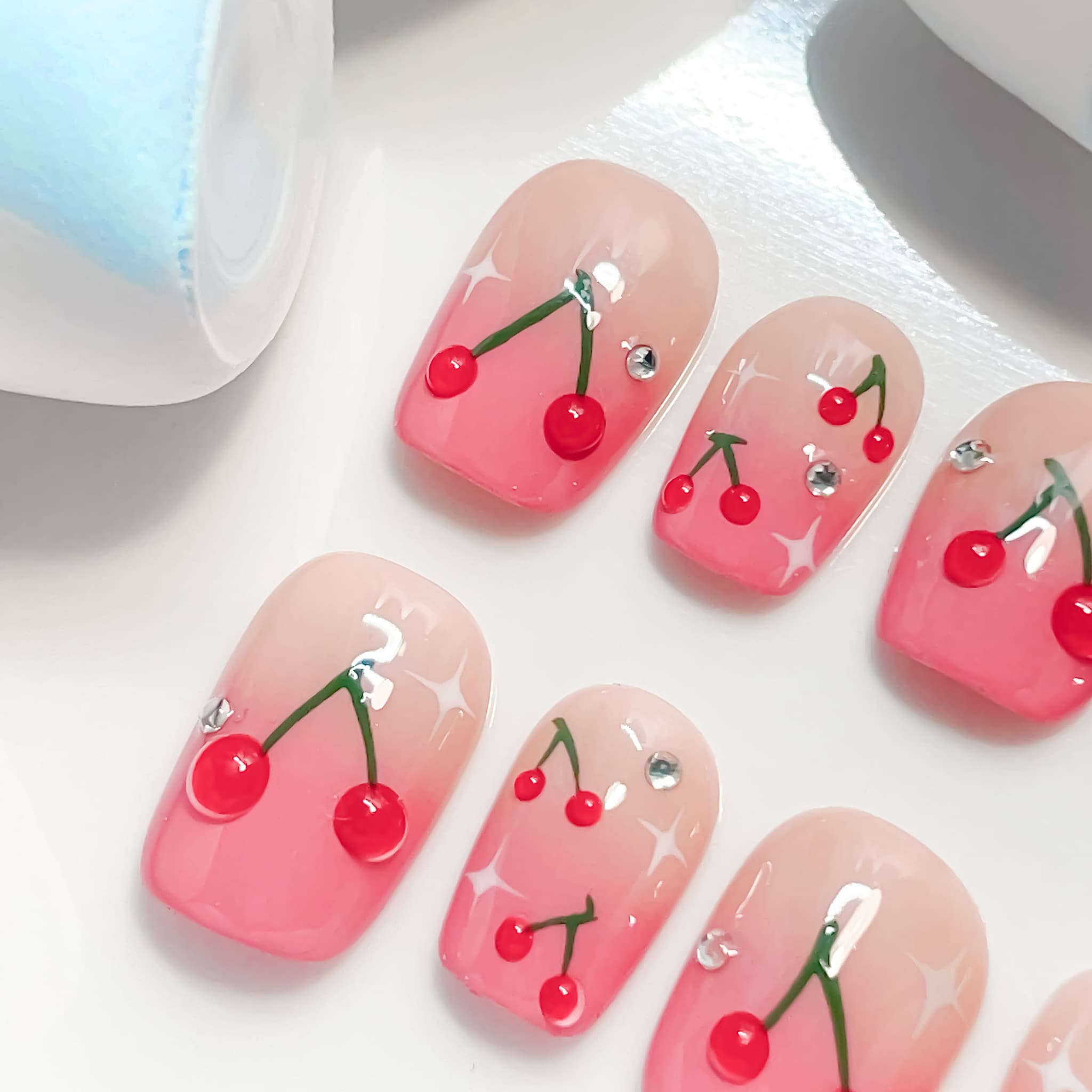 short length hot pink coffin press on nails with cherry designs