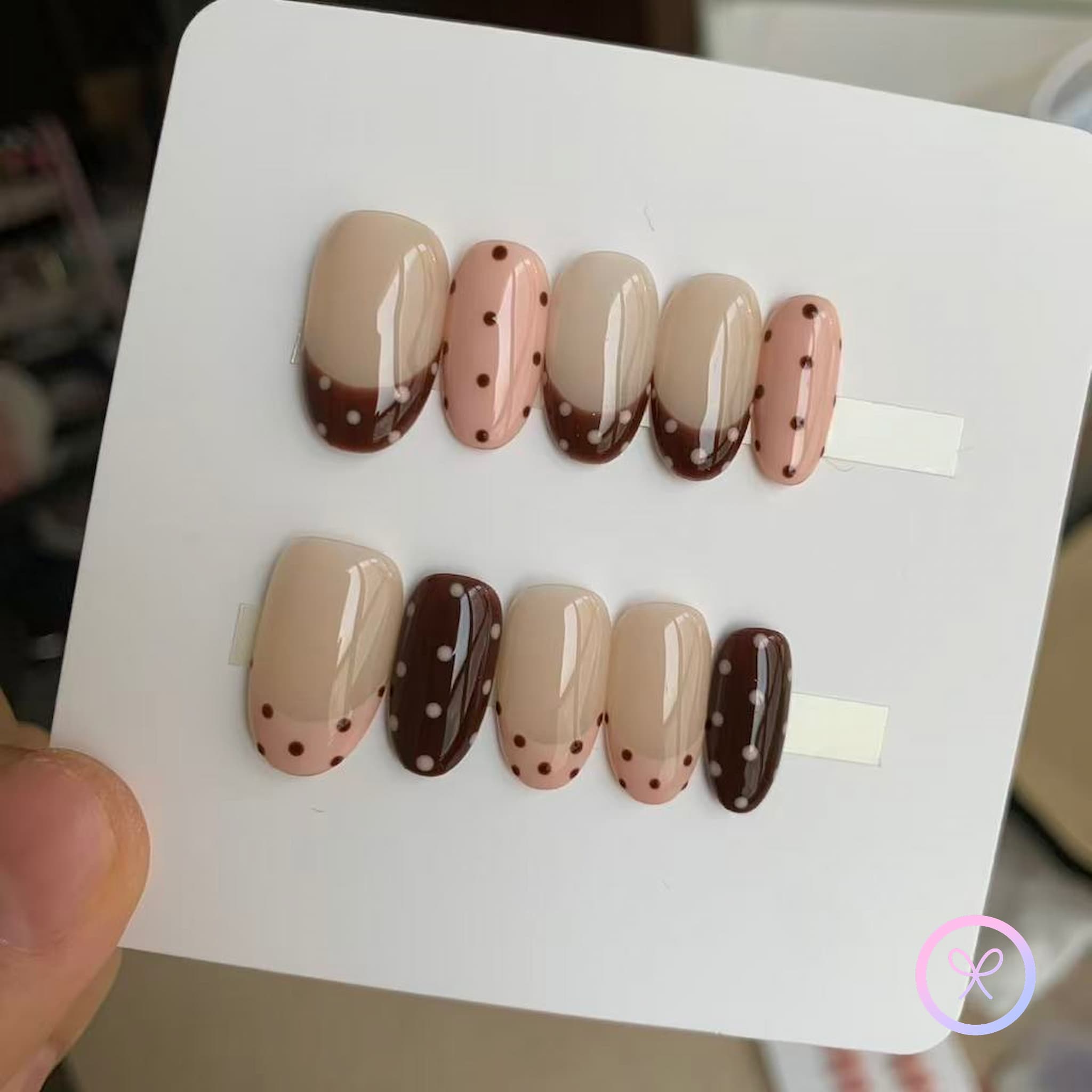 cute nude glossy short almond press on nails with polka dots and french tips design