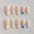 medium length nude almond press on nails with french tips design