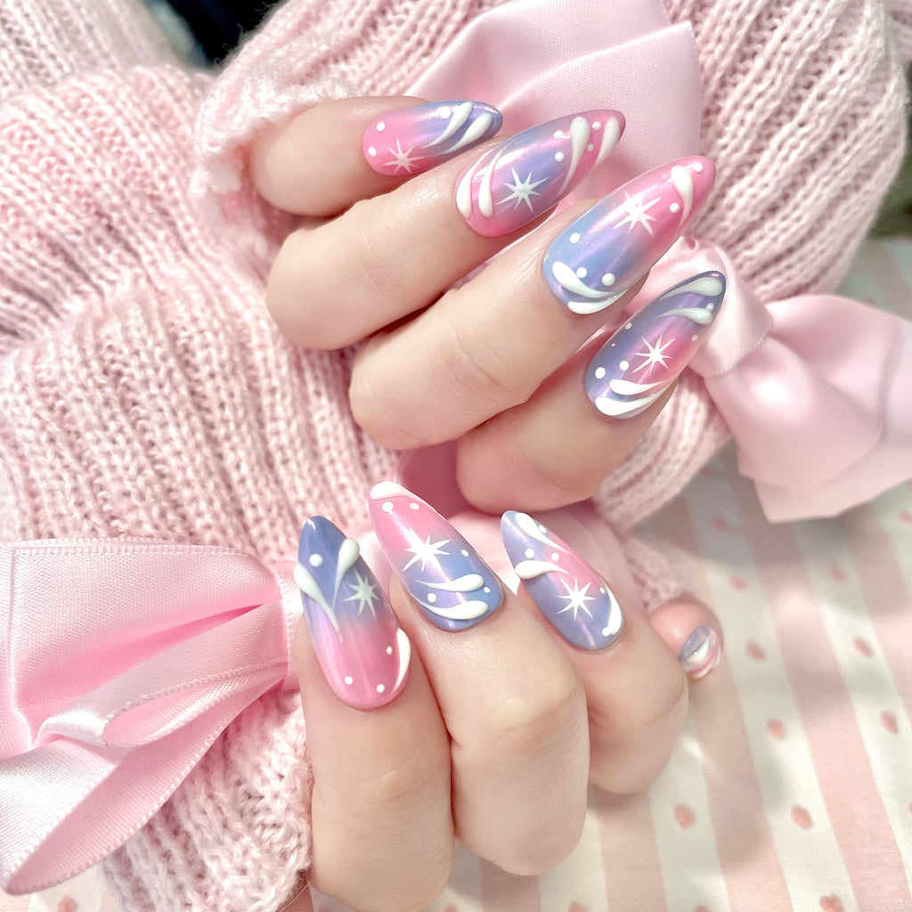 medium length light pink almond press on nails with stars and swirl design