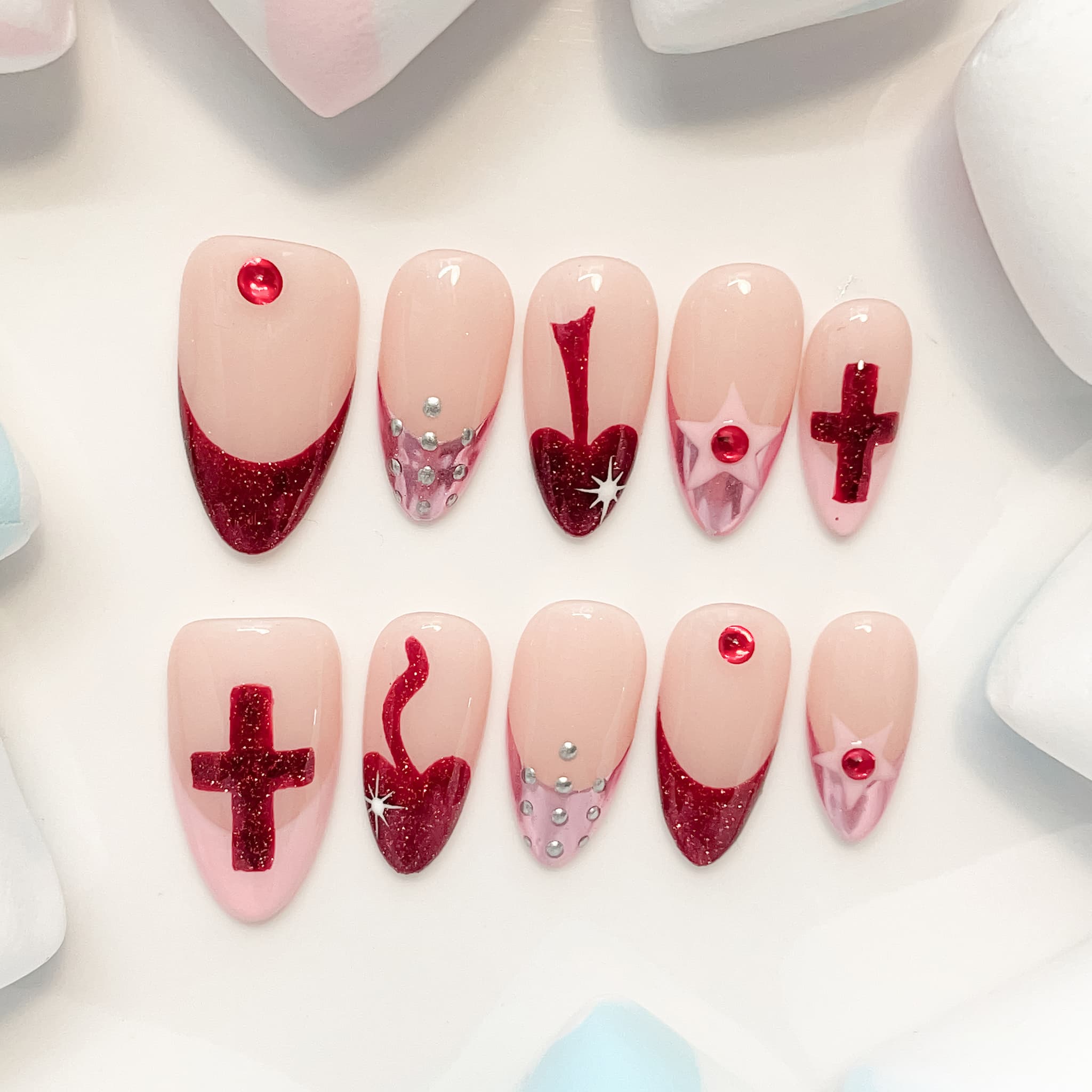medium length red almond press on nails with crusader design