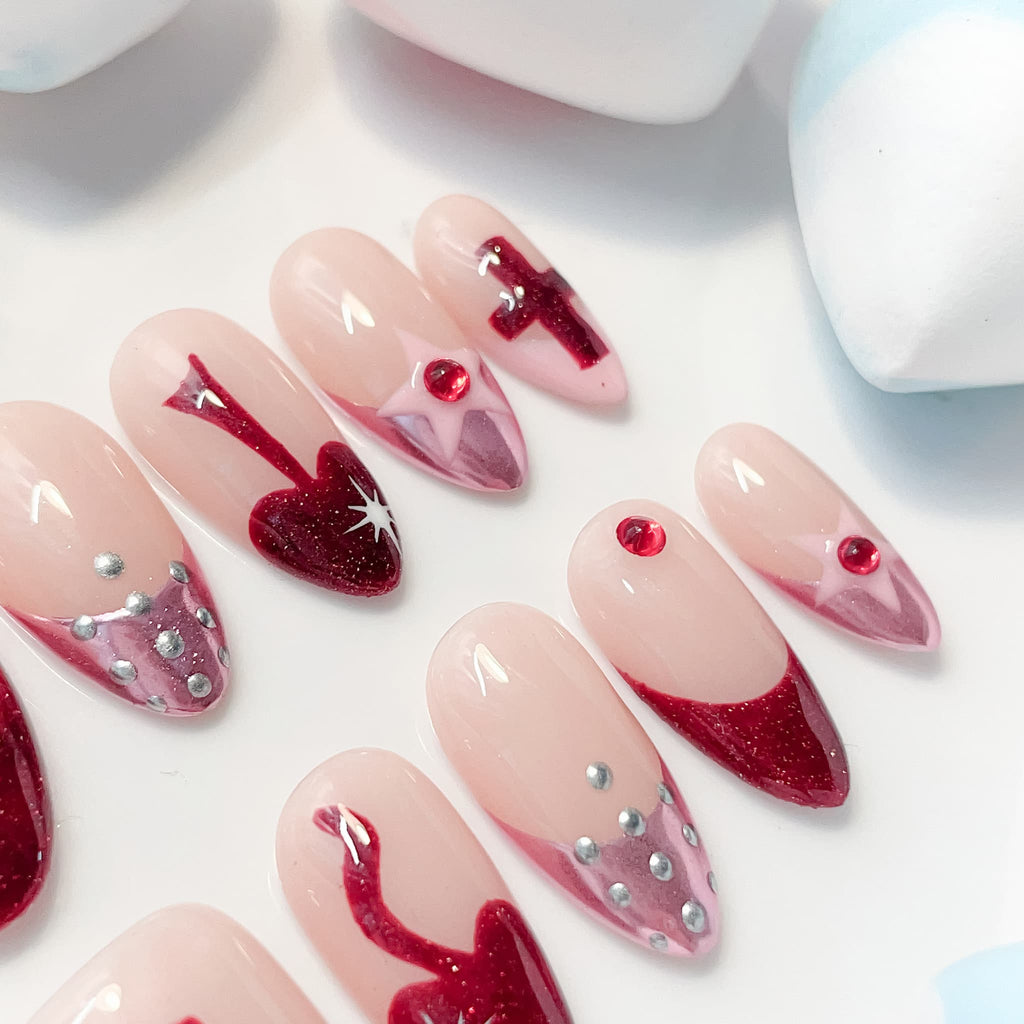 medium length red almond press on nails with crusader design