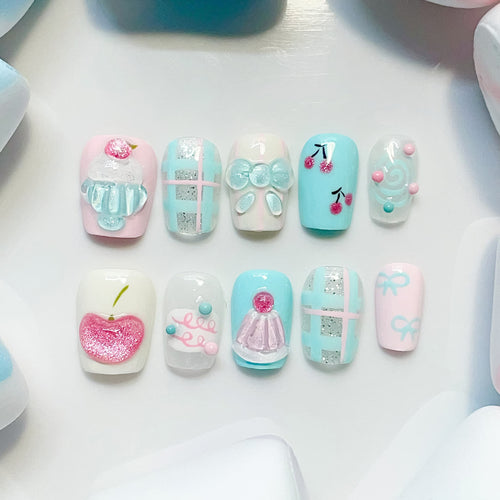 short length light blue coffin press on nails with cupcake and cherry design
