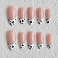 medium length white almond press on nails with dalmatian design, french tips