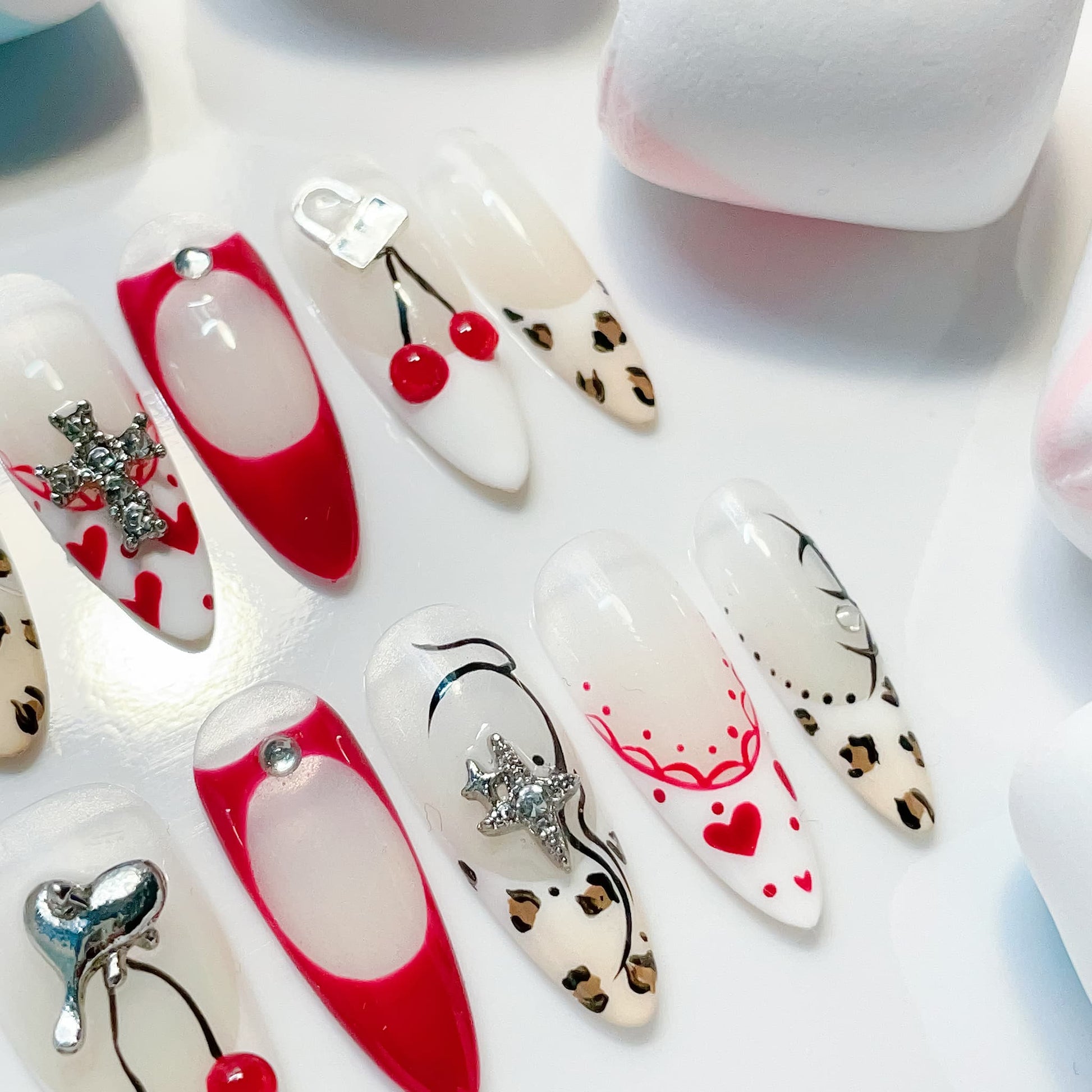 long length red almond press on nails with cherry and animal print design