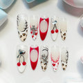 long length red almond press on nails with cherry and animal print design