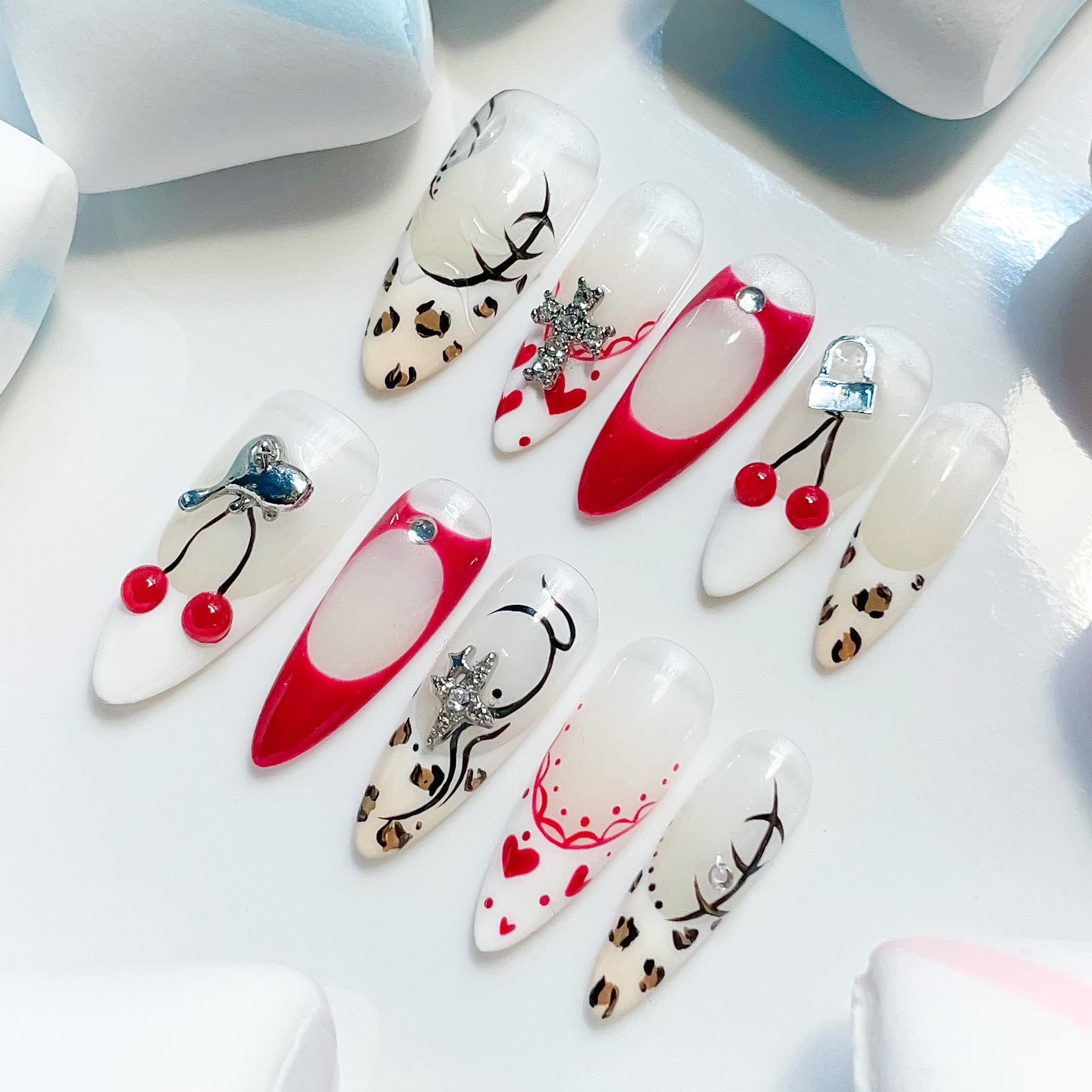 long length red almond press on nails with cherry and animal print design