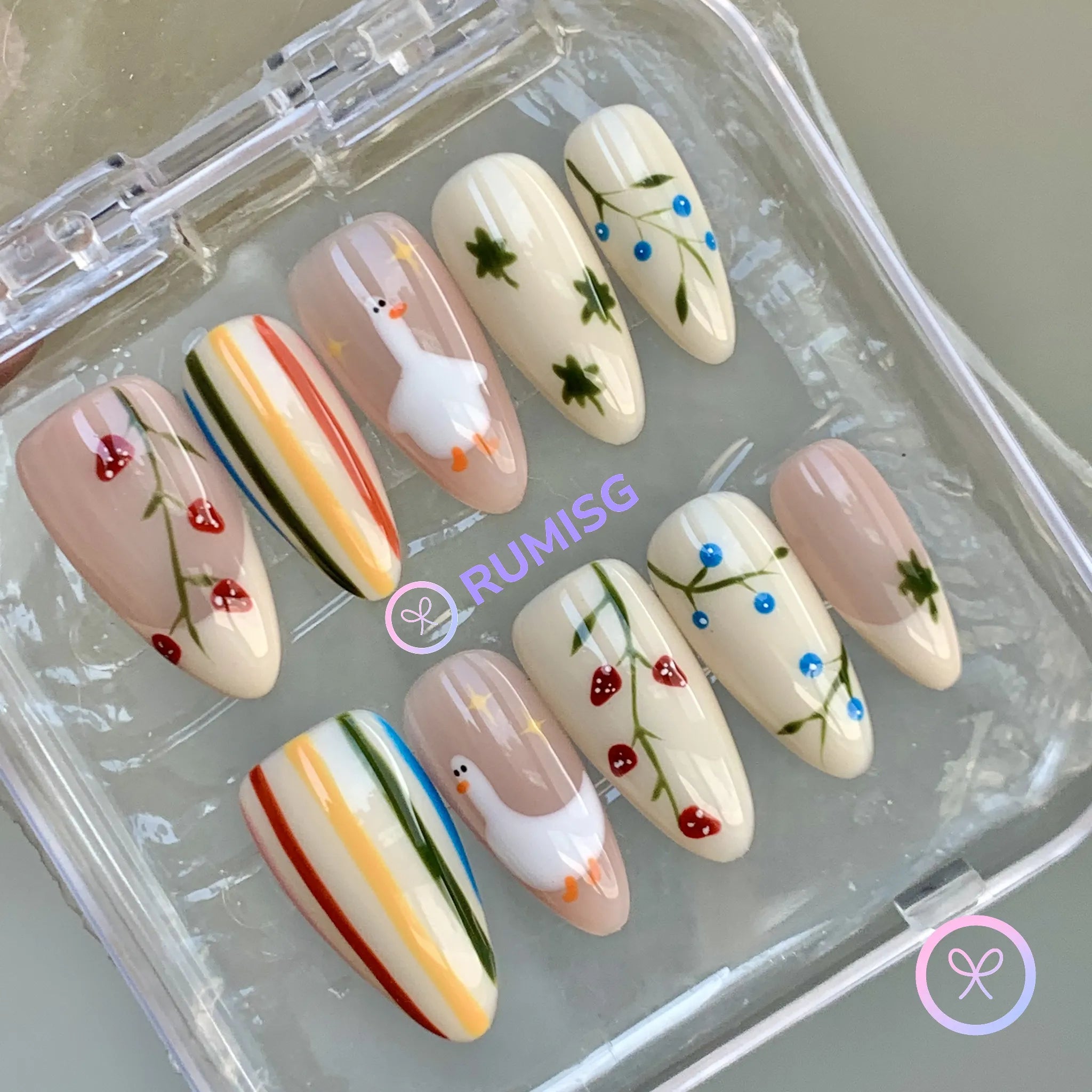 cottagecore white glossy medium almond press on nails with duck and strawberry motifs