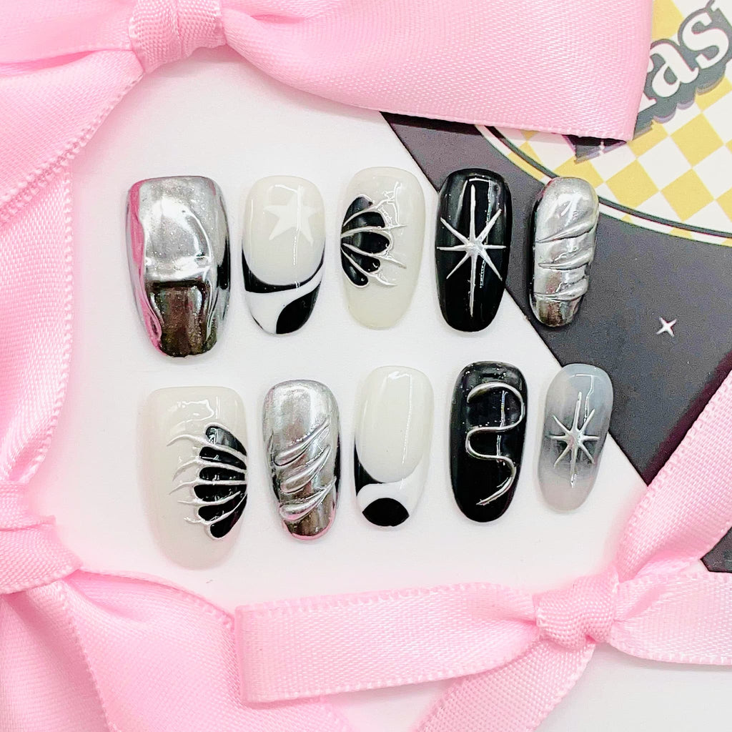 short length silver oval press on nails with metallic wings design