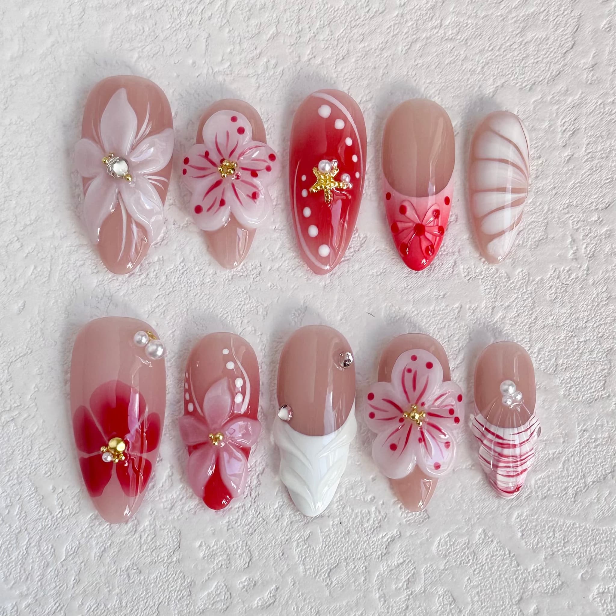 medium length nude almond press on nails with 3d flower design
