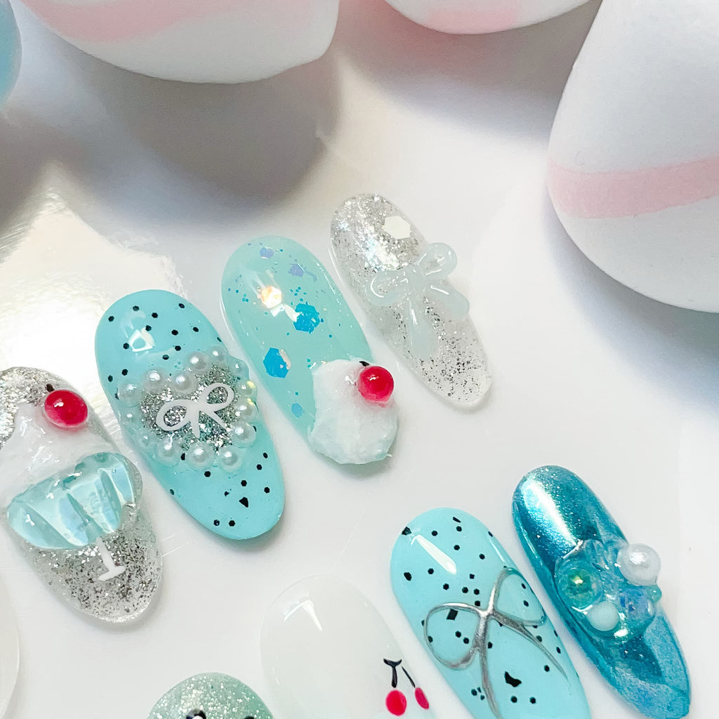 medium length cyan oval press on nails with cherry design