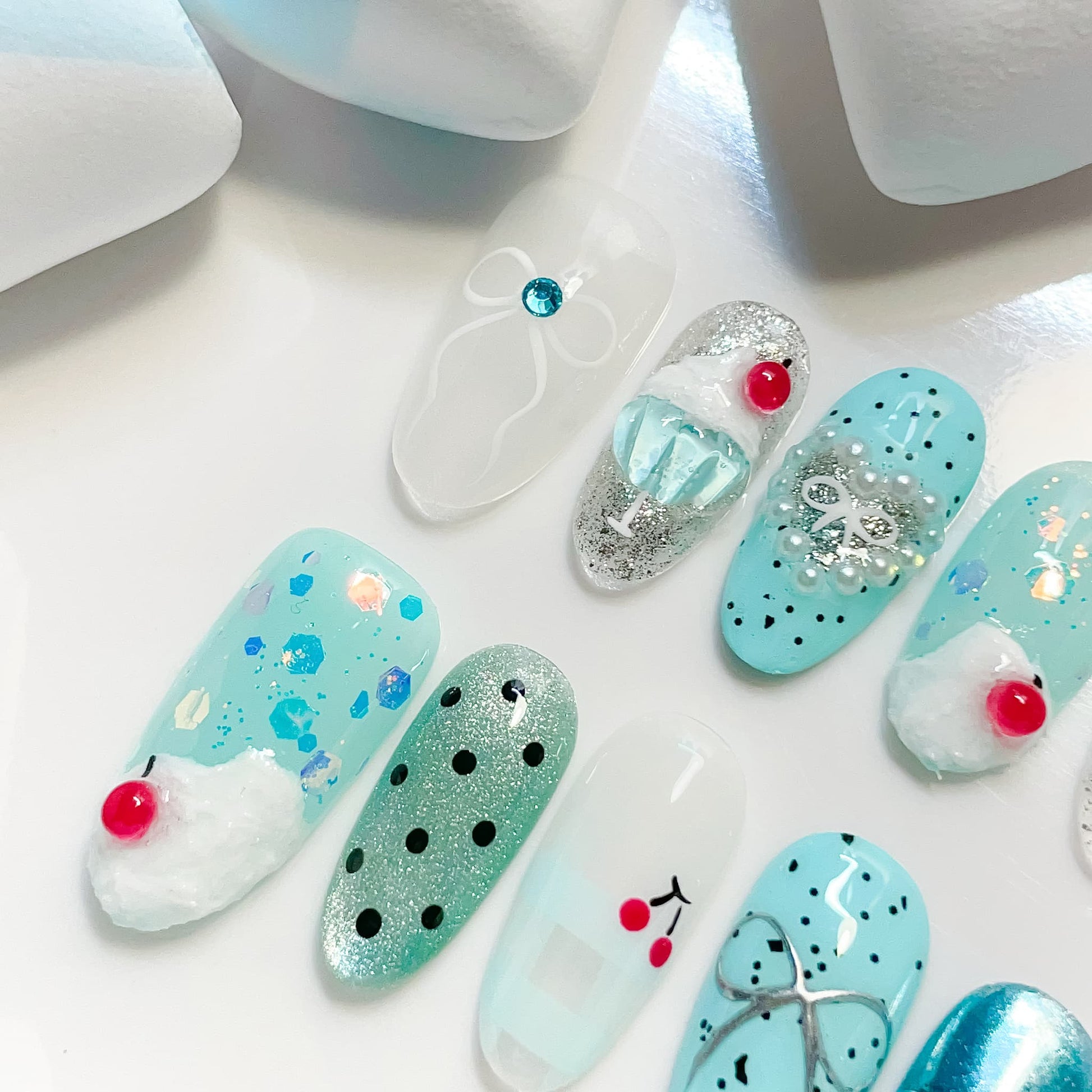 medium length cyan oval press on nails with cherry design