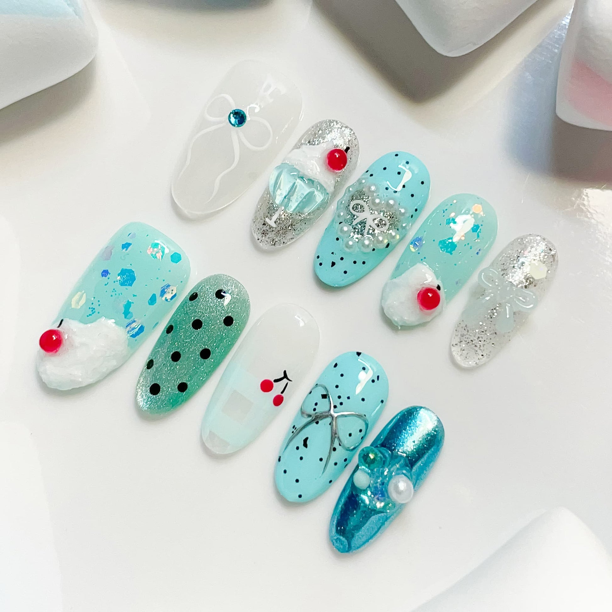 medium length cyan oval press on nails with cherry design