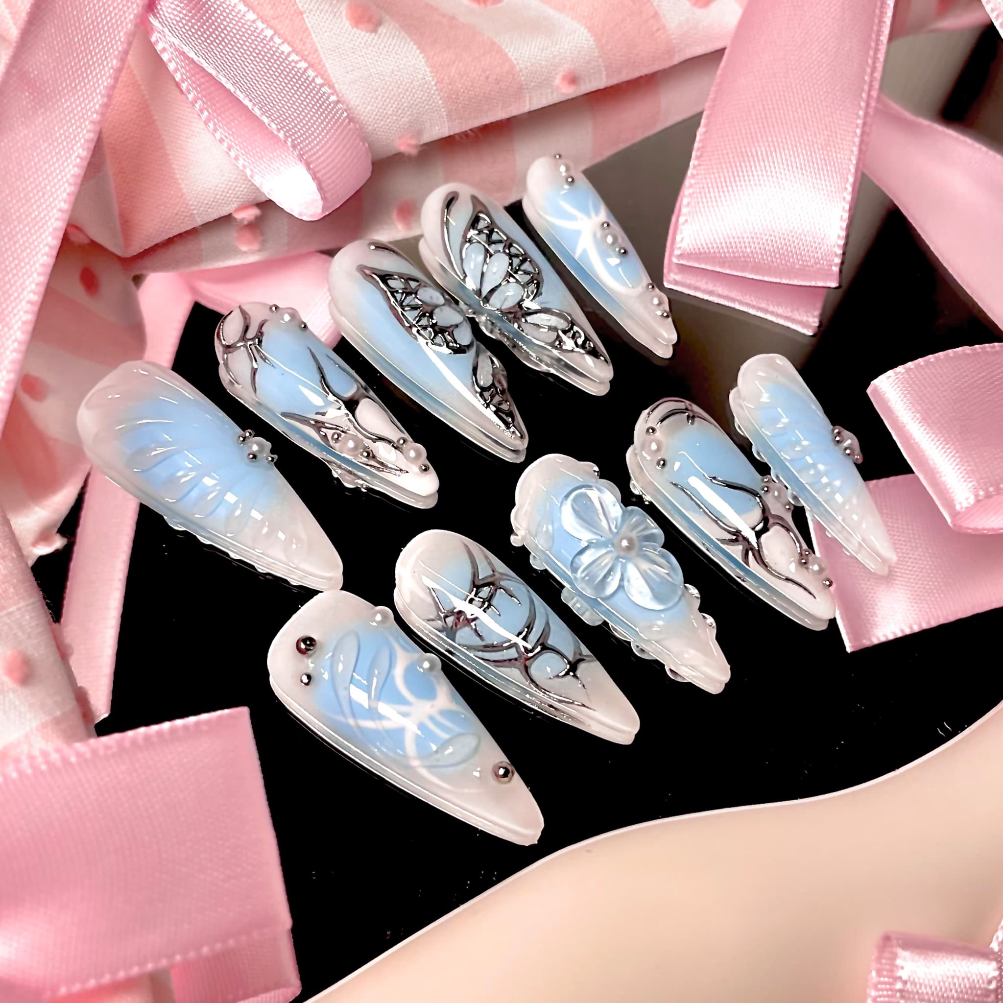 light blue long length stiletto press on nails with butterfly design