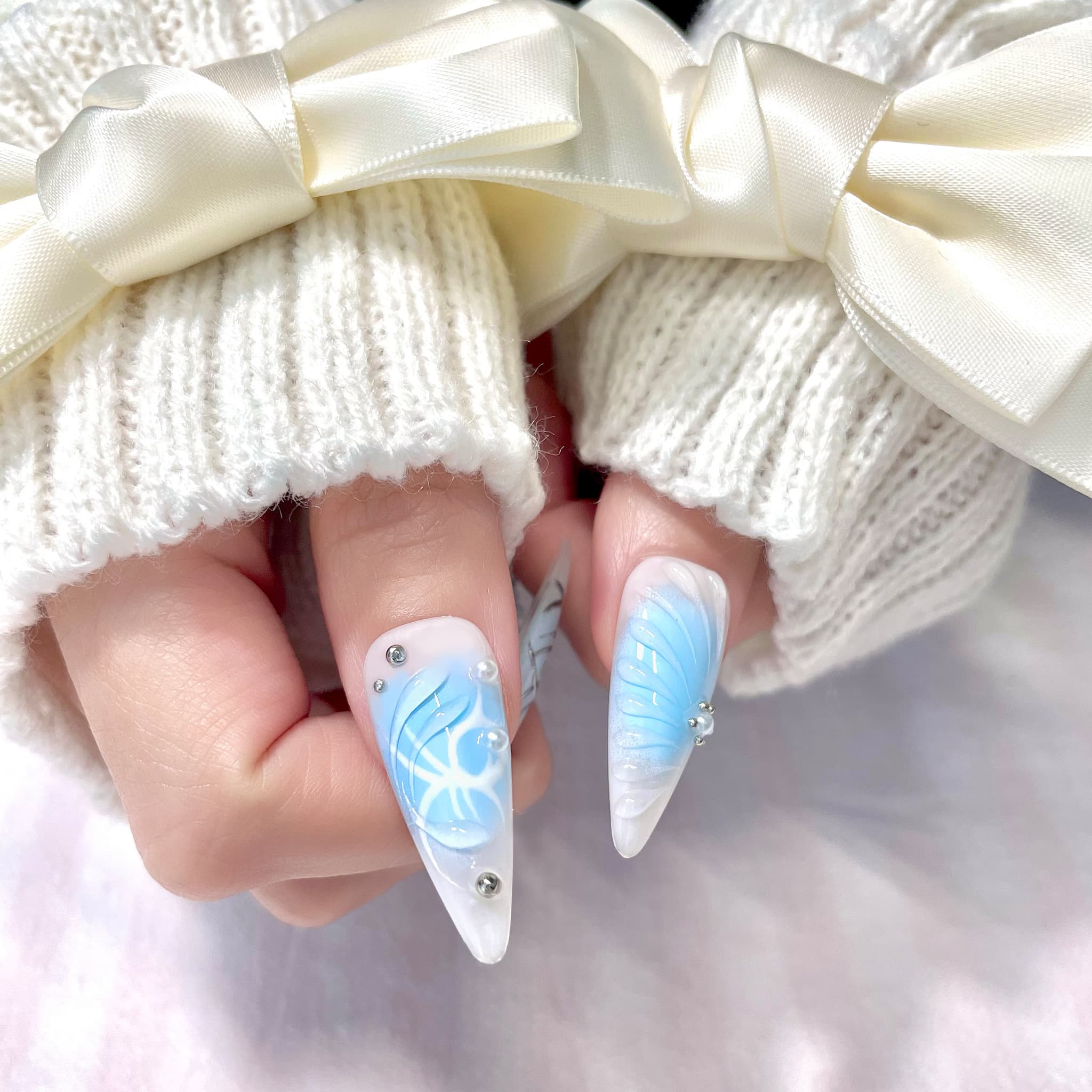 light blue long length stiletto press on nails with butterfly design