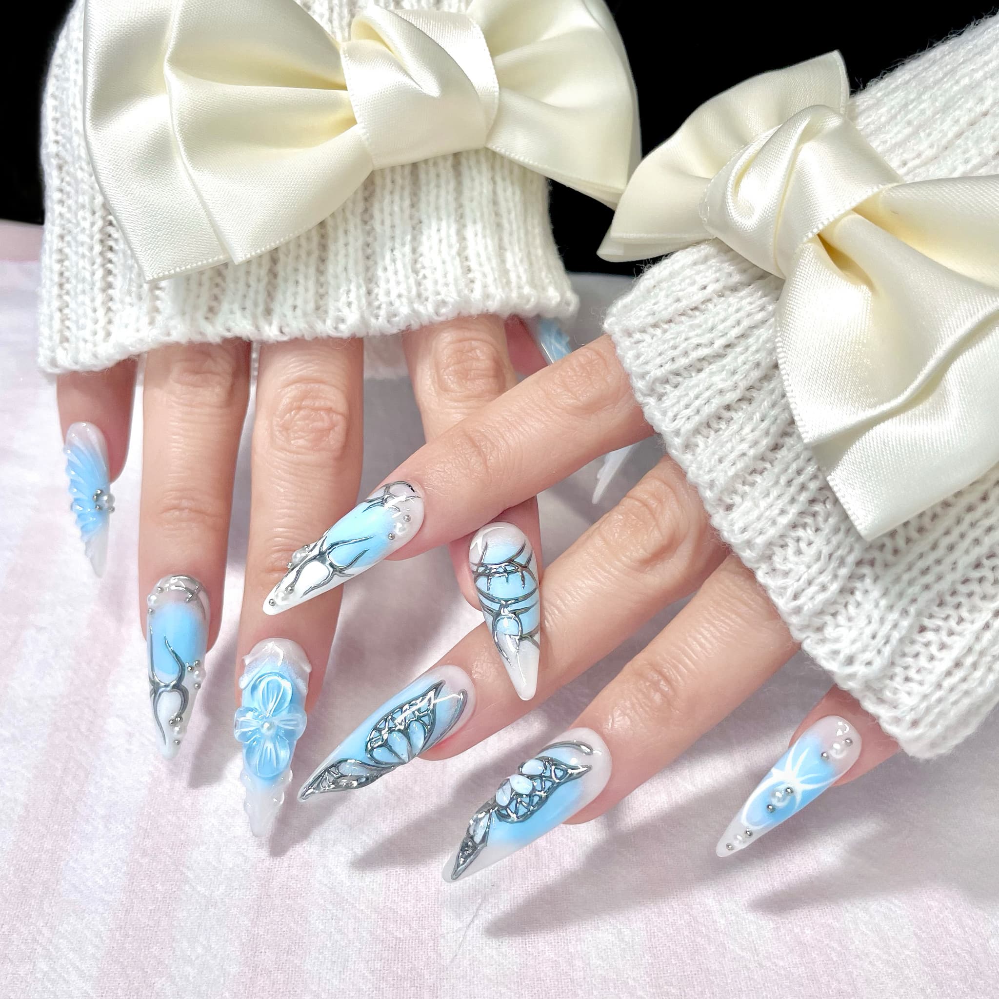 light blue long length stiletto press on nails with butterfly design