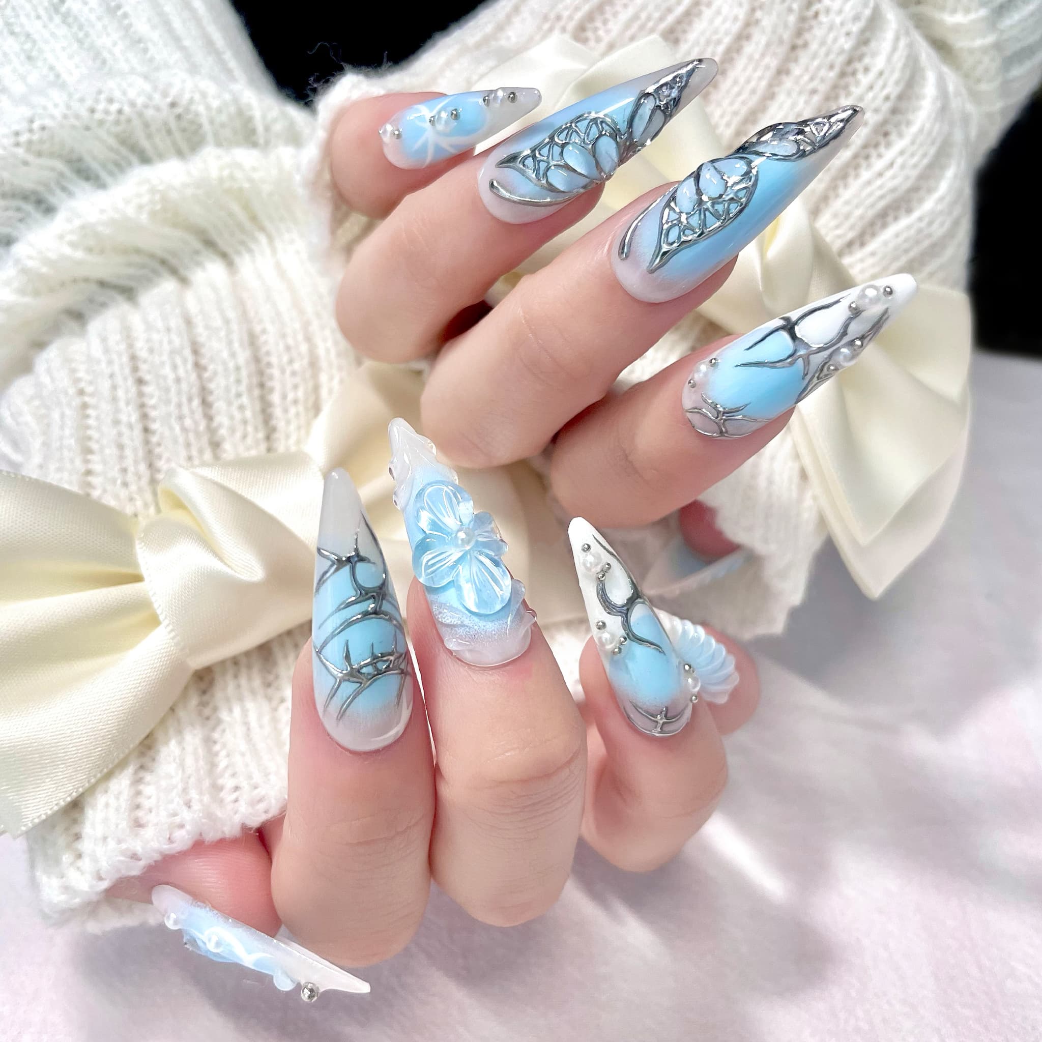 light blue long length stiletto press on nails with butterfly design